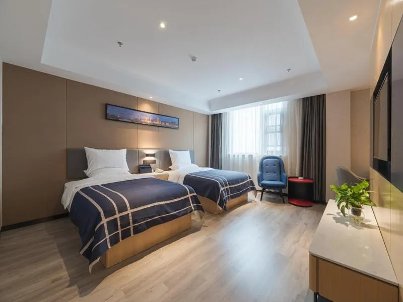Bed in LanOu Hotel Wuxi Anzhen East High-Speed Railway Station