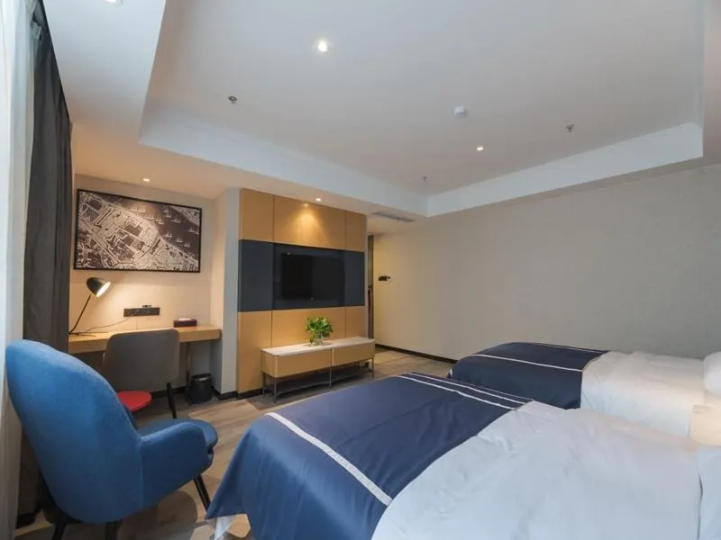 Bed in LanOu Hotel Wuxi Anzhen East High-Speed Railway Station