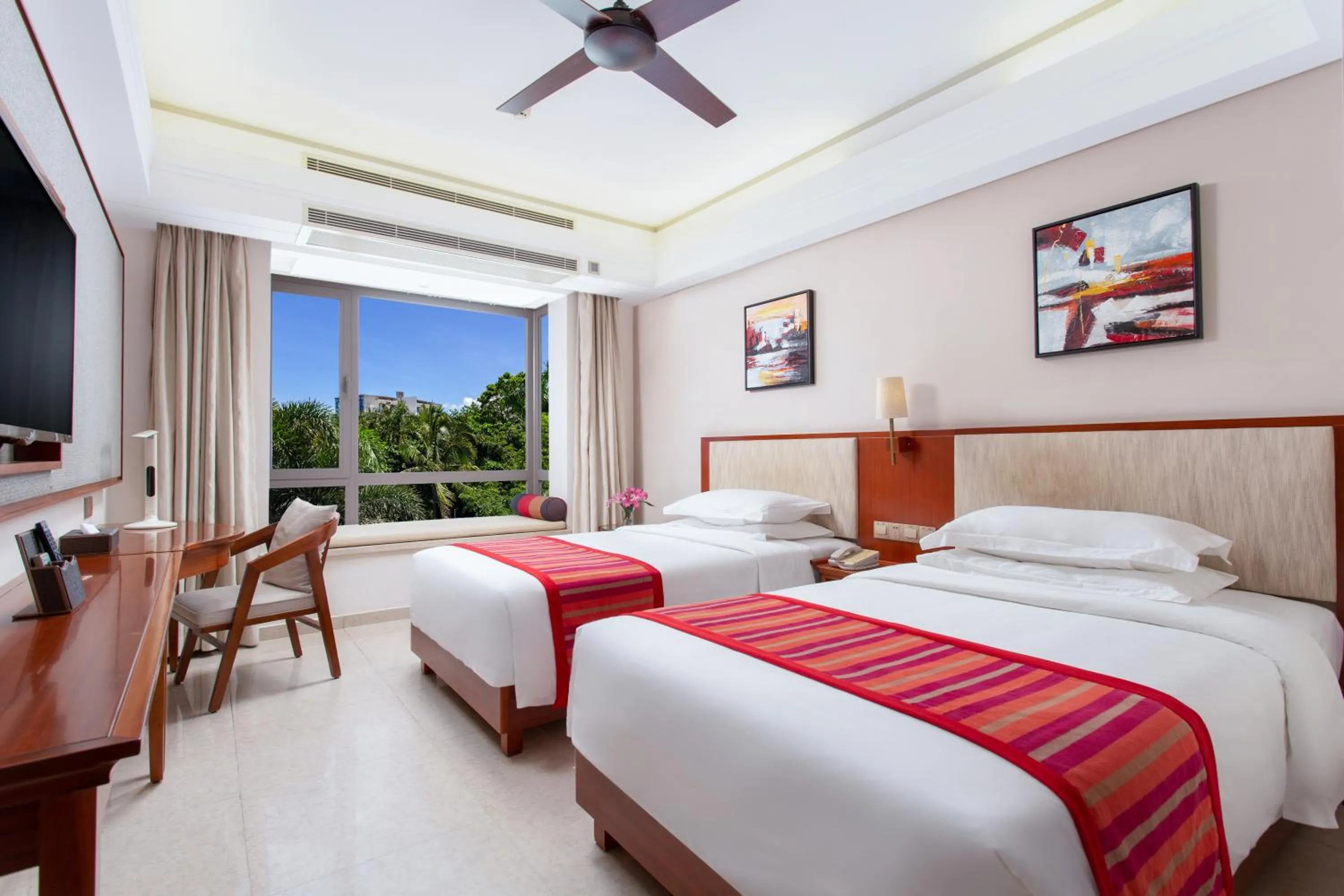 Bed in Sanya Seacube Holiday Hotel