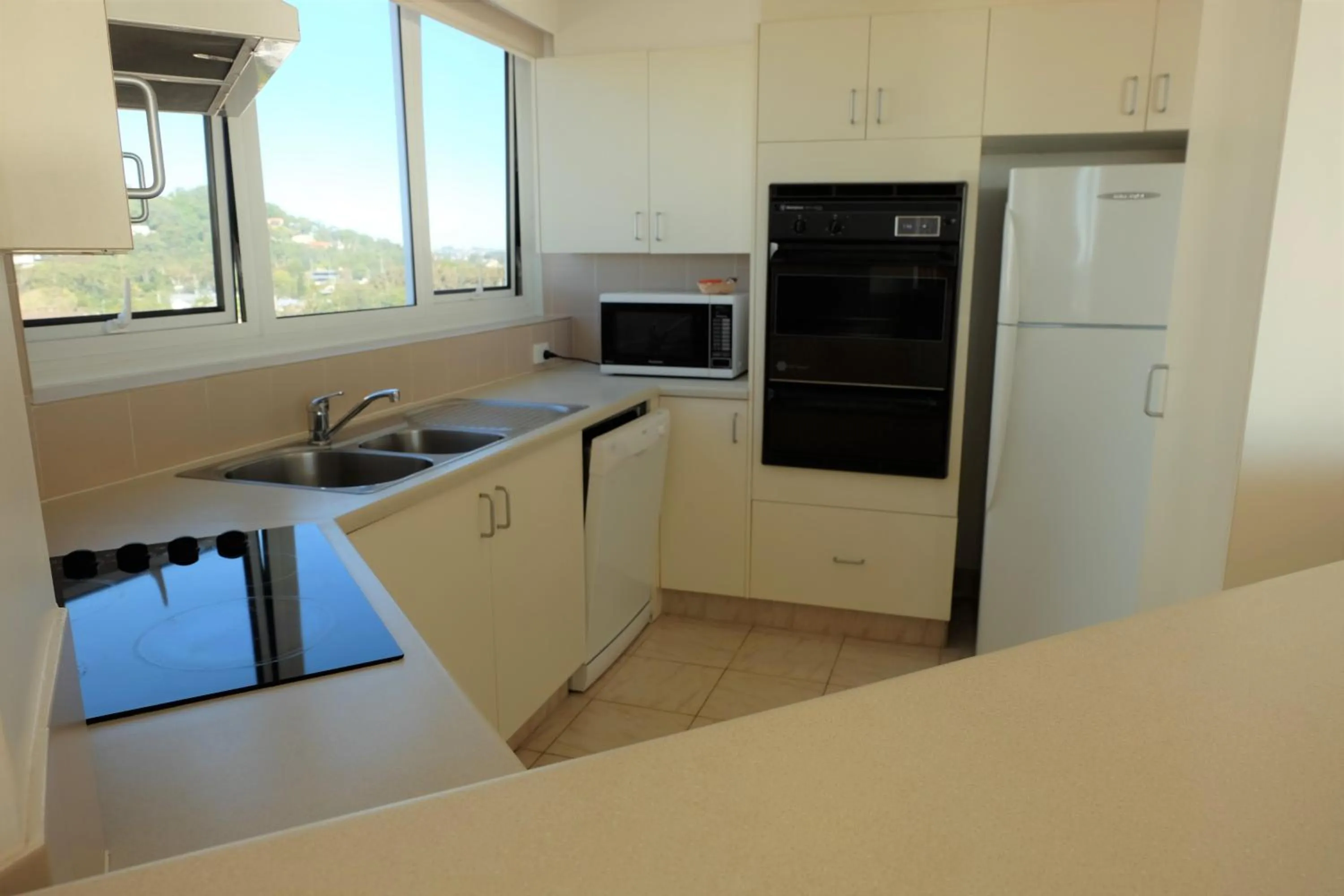 Kitchen or kitchenette in Meridian Tower Kirra Beach