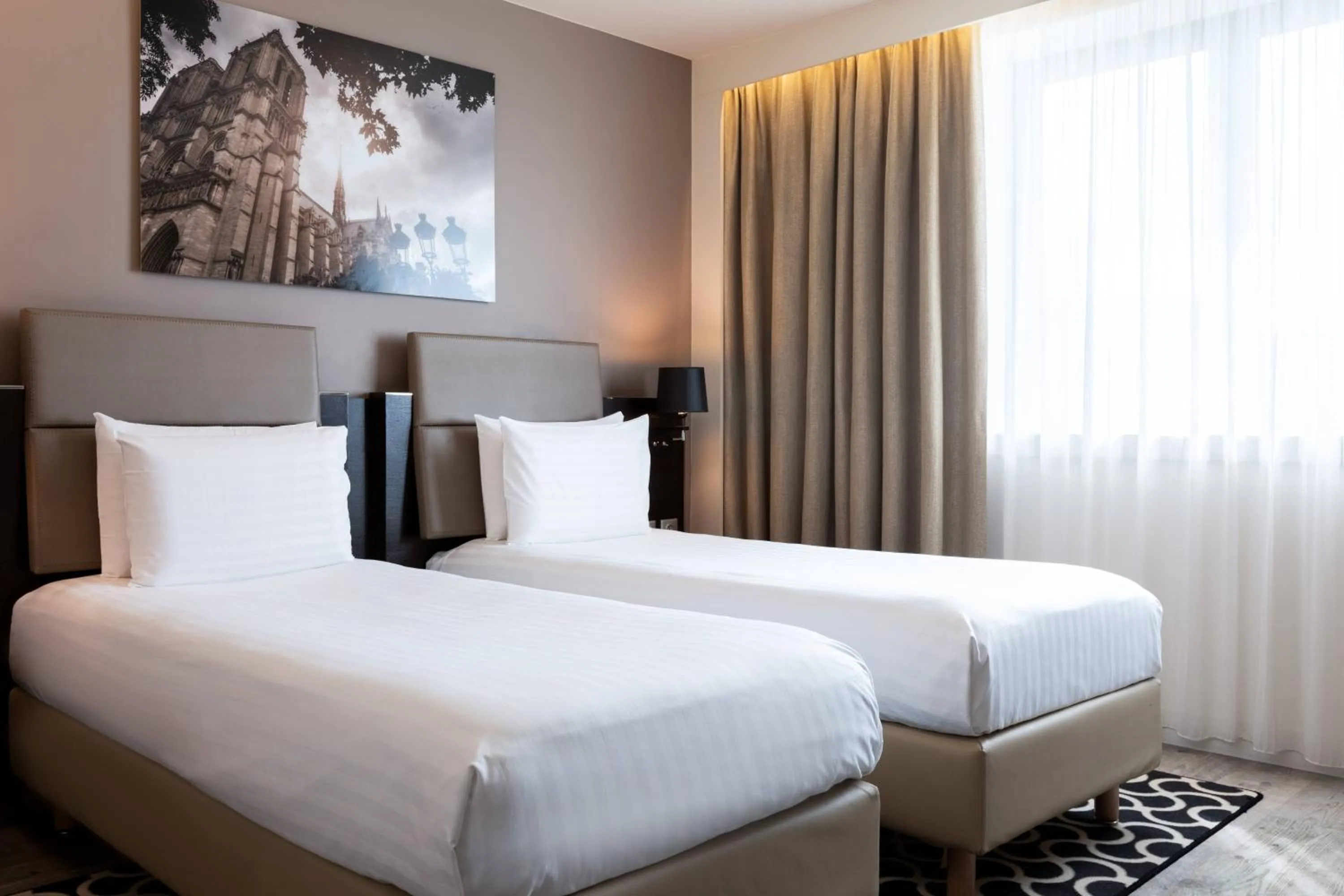 Photo of the whole room, Bed in AC Hotel Paris Porte Maillot by Marriott