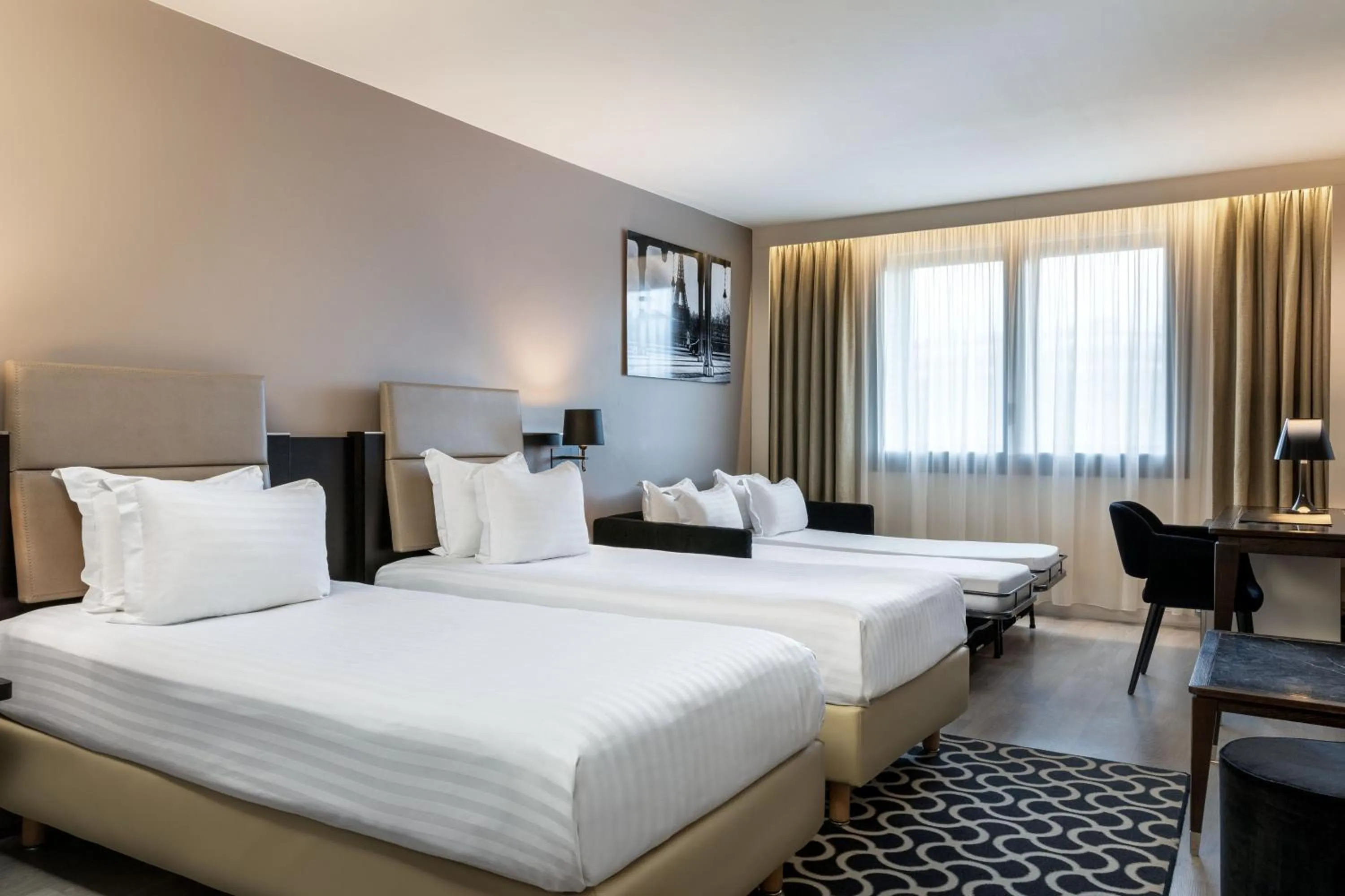 Photo of the whole room, Bed in AC Hotel Paris Porte Maillot by Marriott