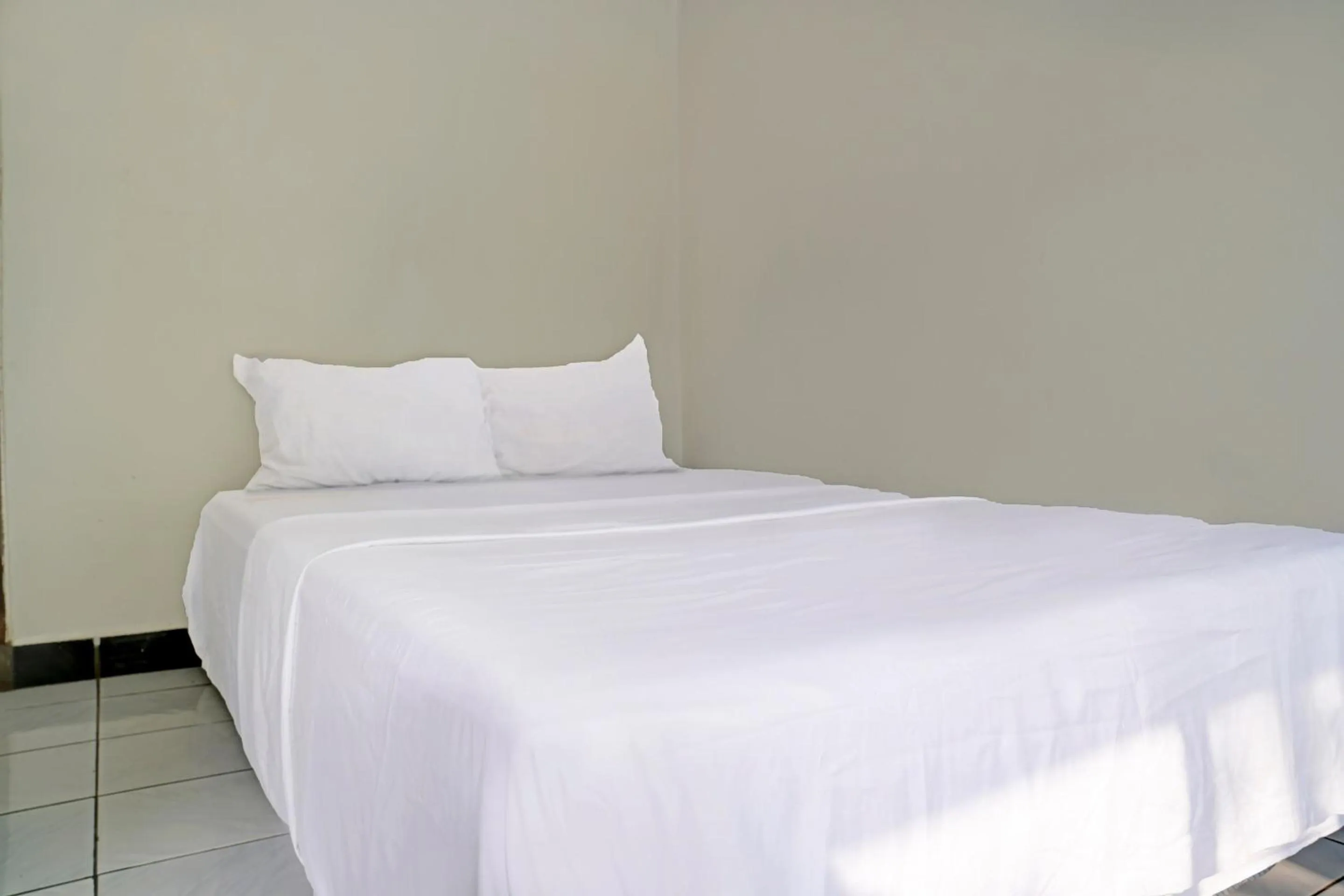 Bedroom in Hotel O Home Stay Syariah Aom Kusman