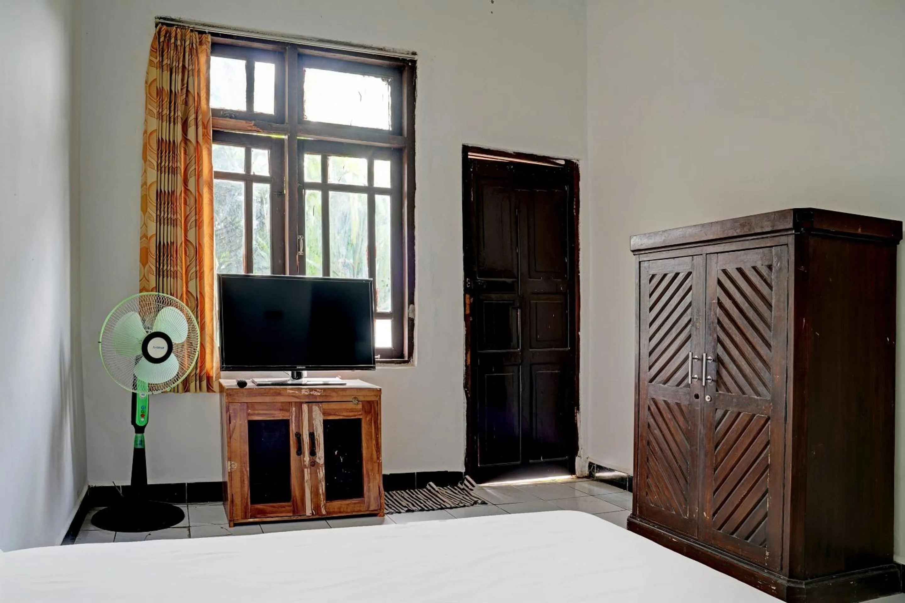 Bedroom in Hotel O Home Stay Syariah Aom Kusman