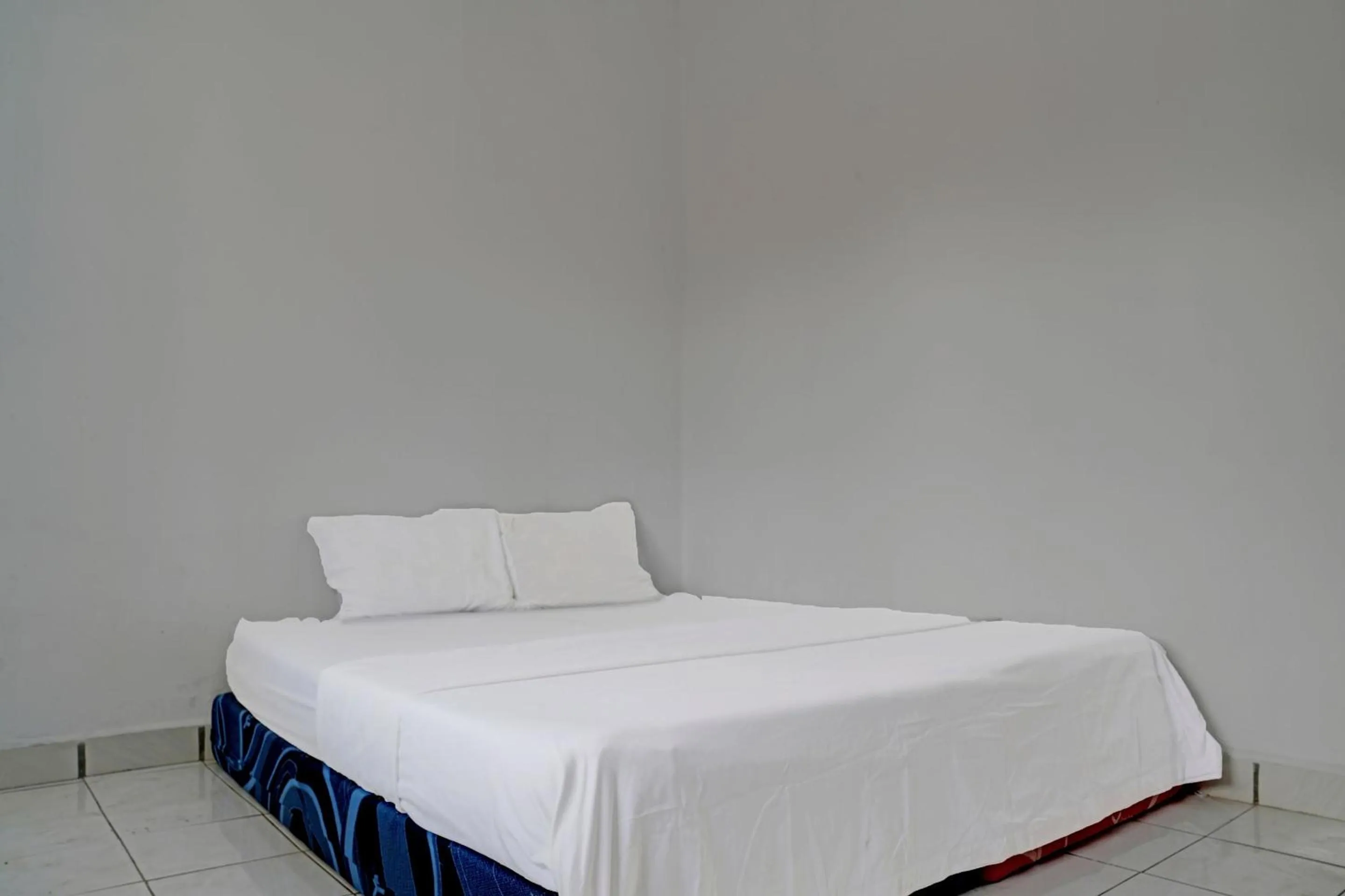 Bedroom in Hotel O Home Stay Syariah Aom Kusman