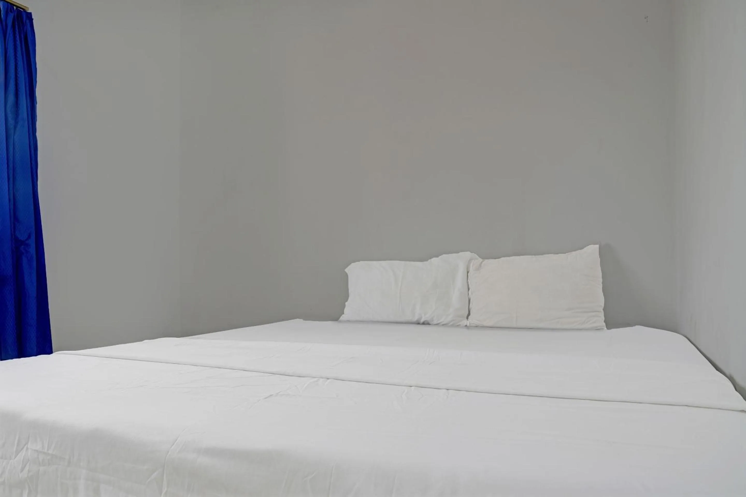 Bedroom in Hotel O Home Stay Syariah Aom Kusman