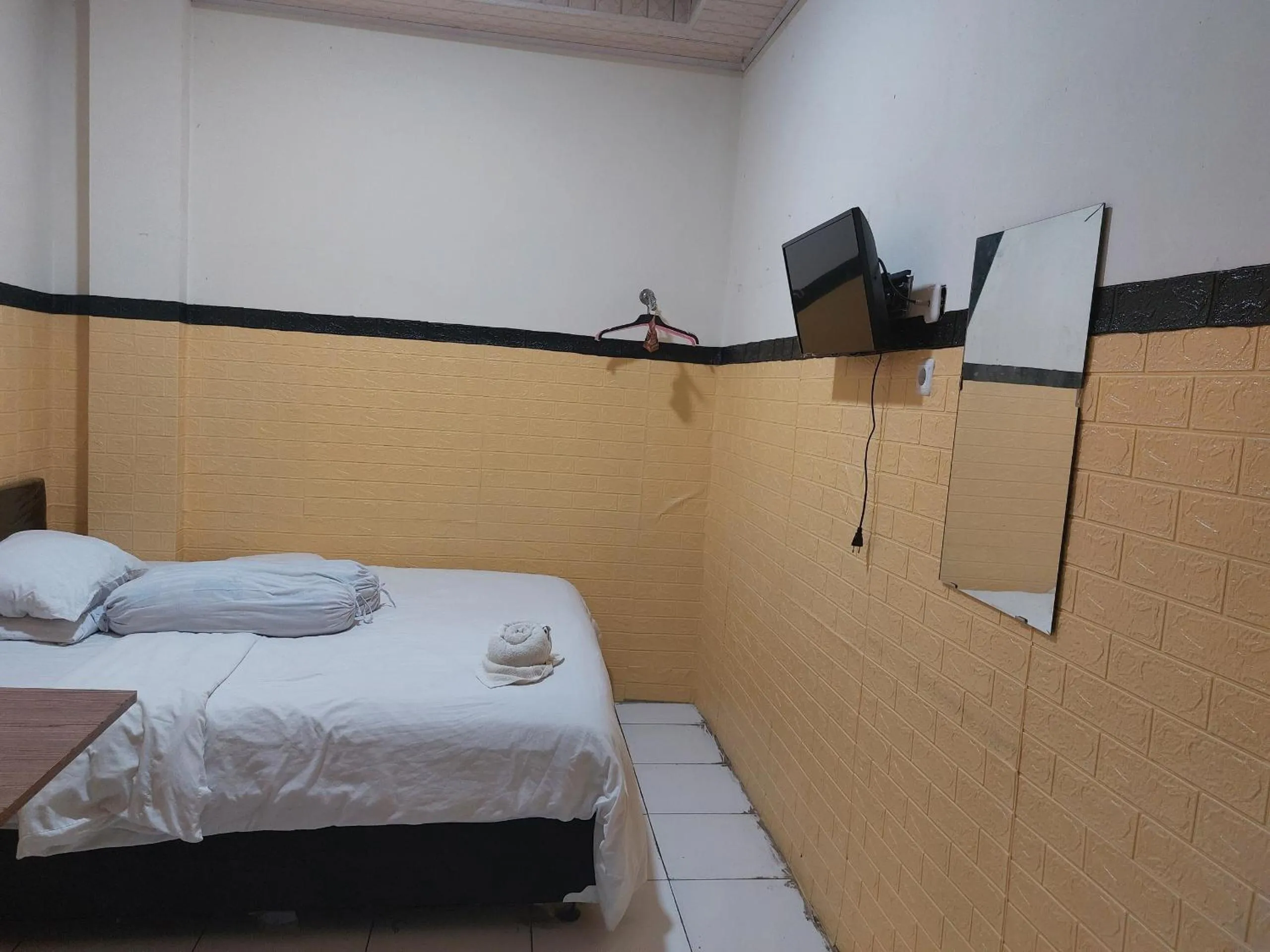 Bedroom, Bed in Hotel O Mahendra HomestayNearTaman Wisata Bukit Rurukan