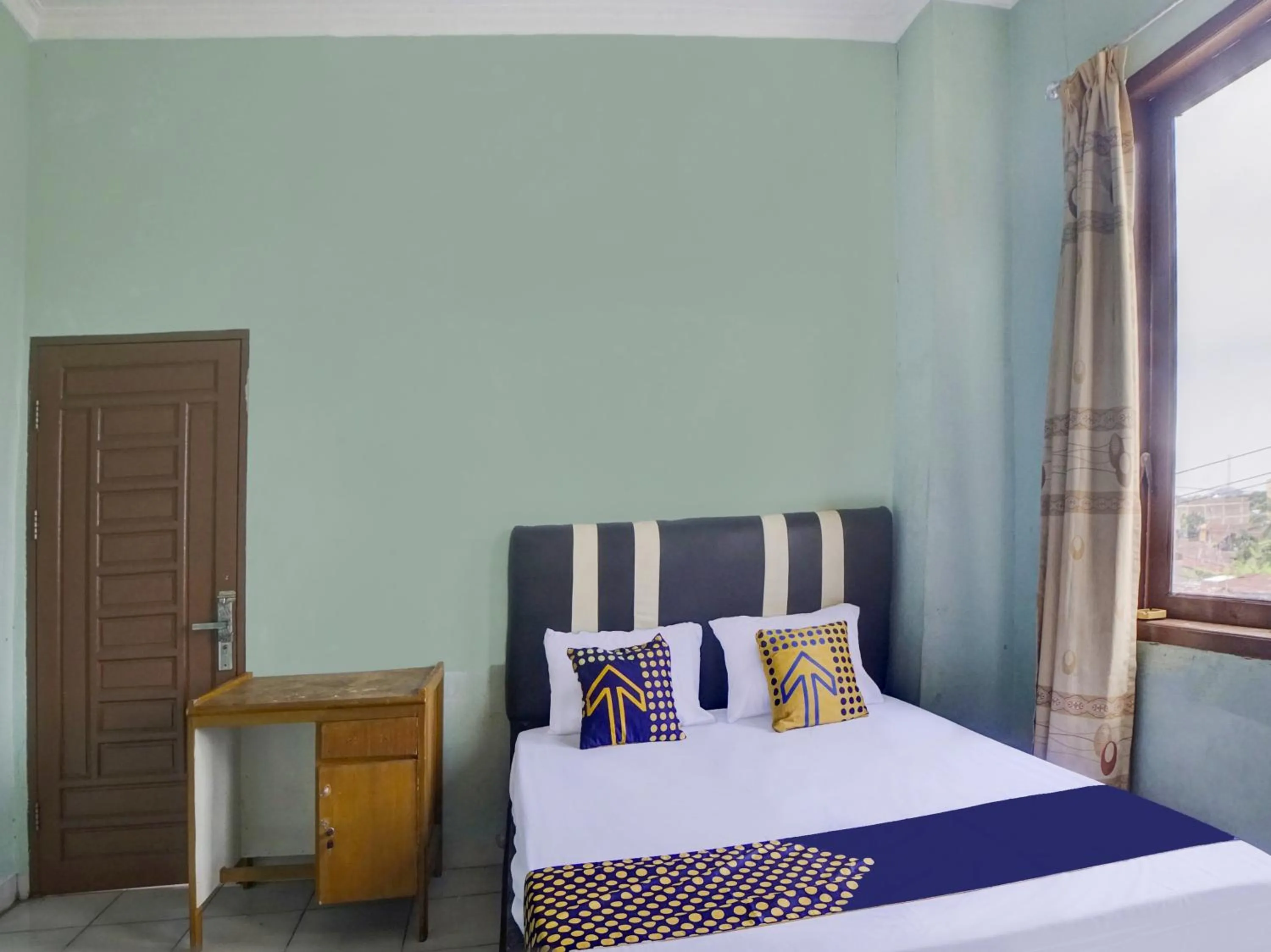 Bedroom, Bed in Hotel O Penginapan Pakam