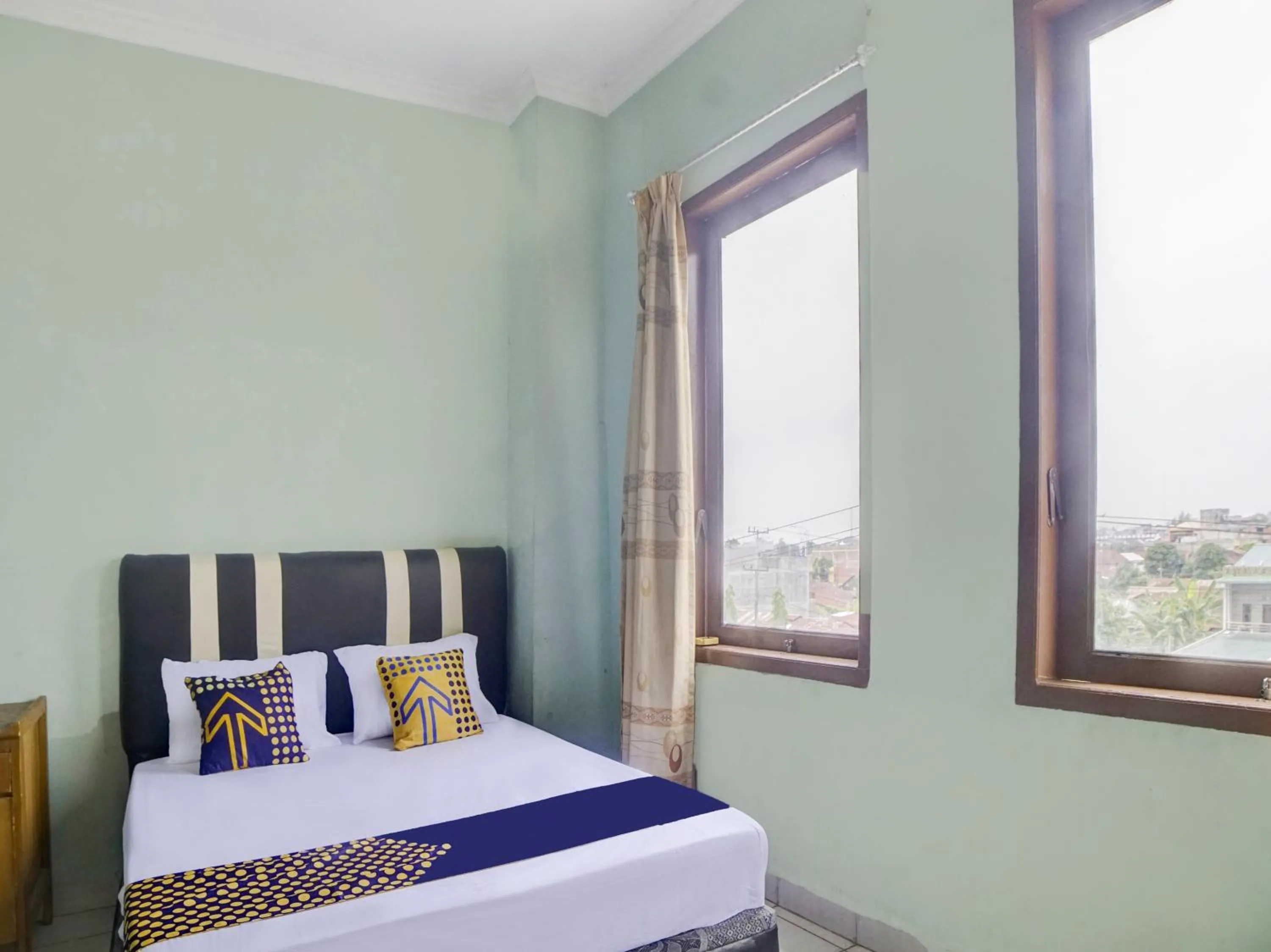 Bedroom, Bed in Hotel O Penginapan Pakam