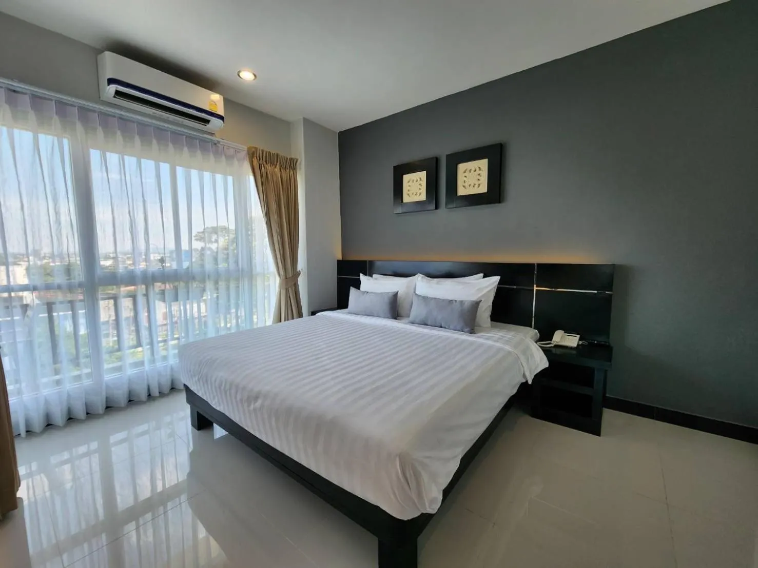 Bed in LHC HOTEL AND RESORT