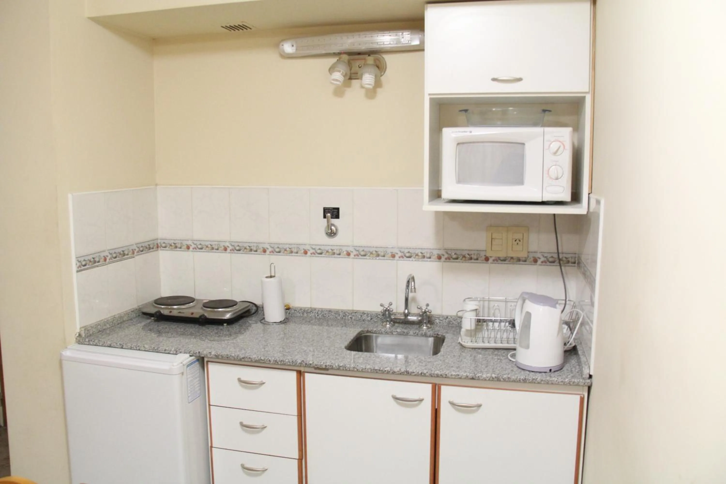 Kitchen or kitchenette in Patio Mediterraneo Apart Hotel