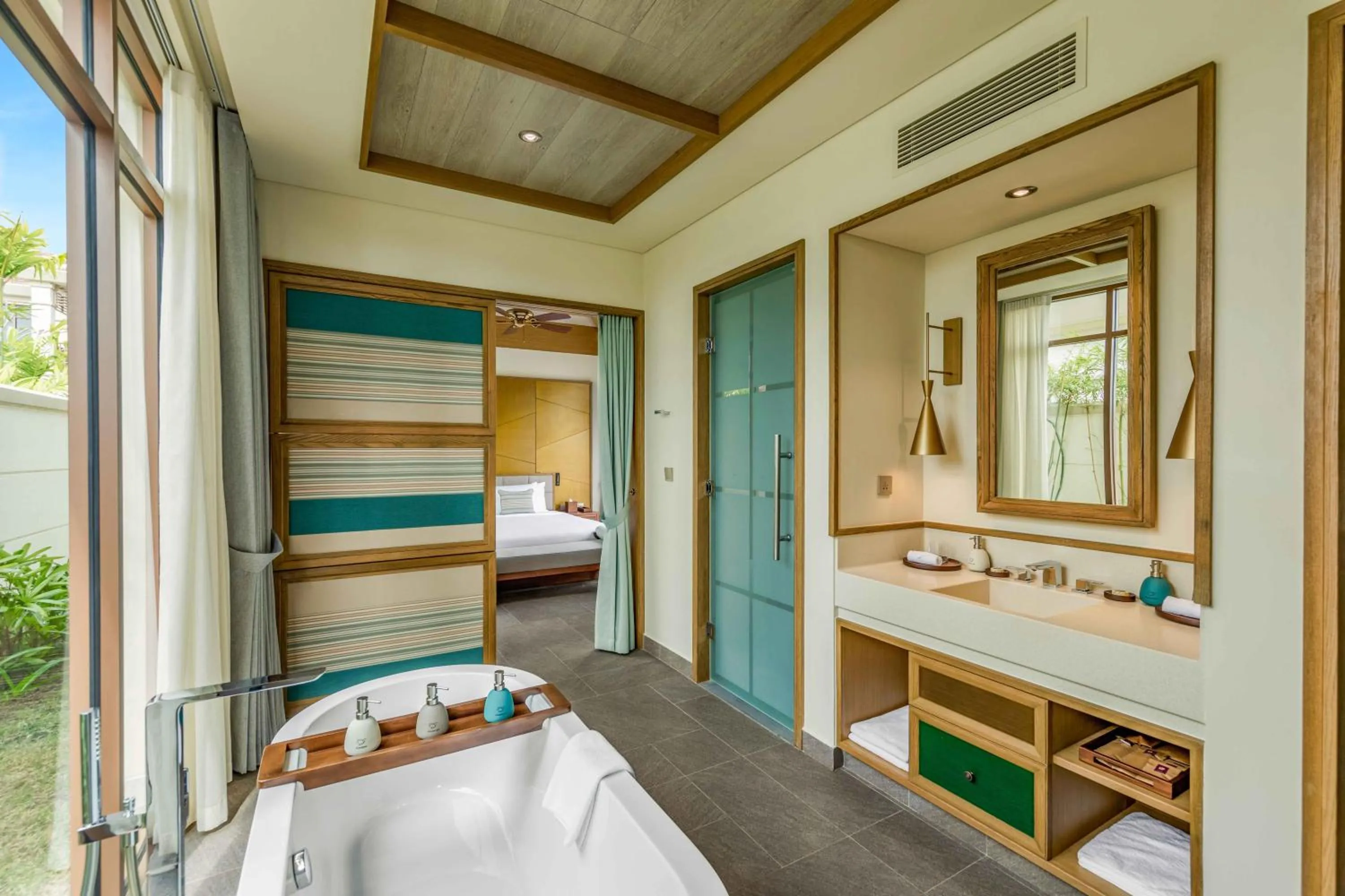 Bathroom, Bed in Fusion Resort and Villas Da Nang