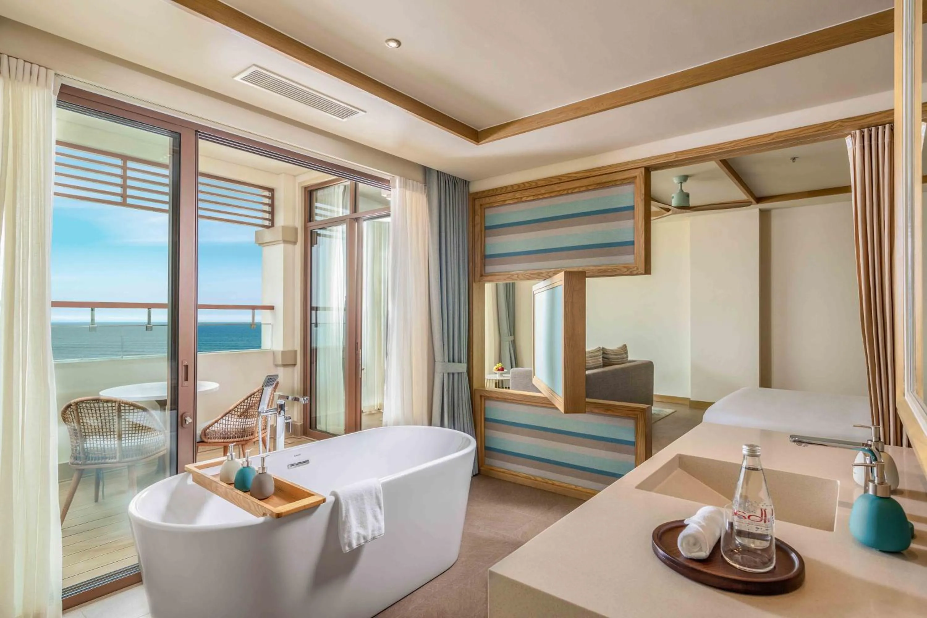 Bathroom, Bed in Fusion Resort and Villas Da Nang