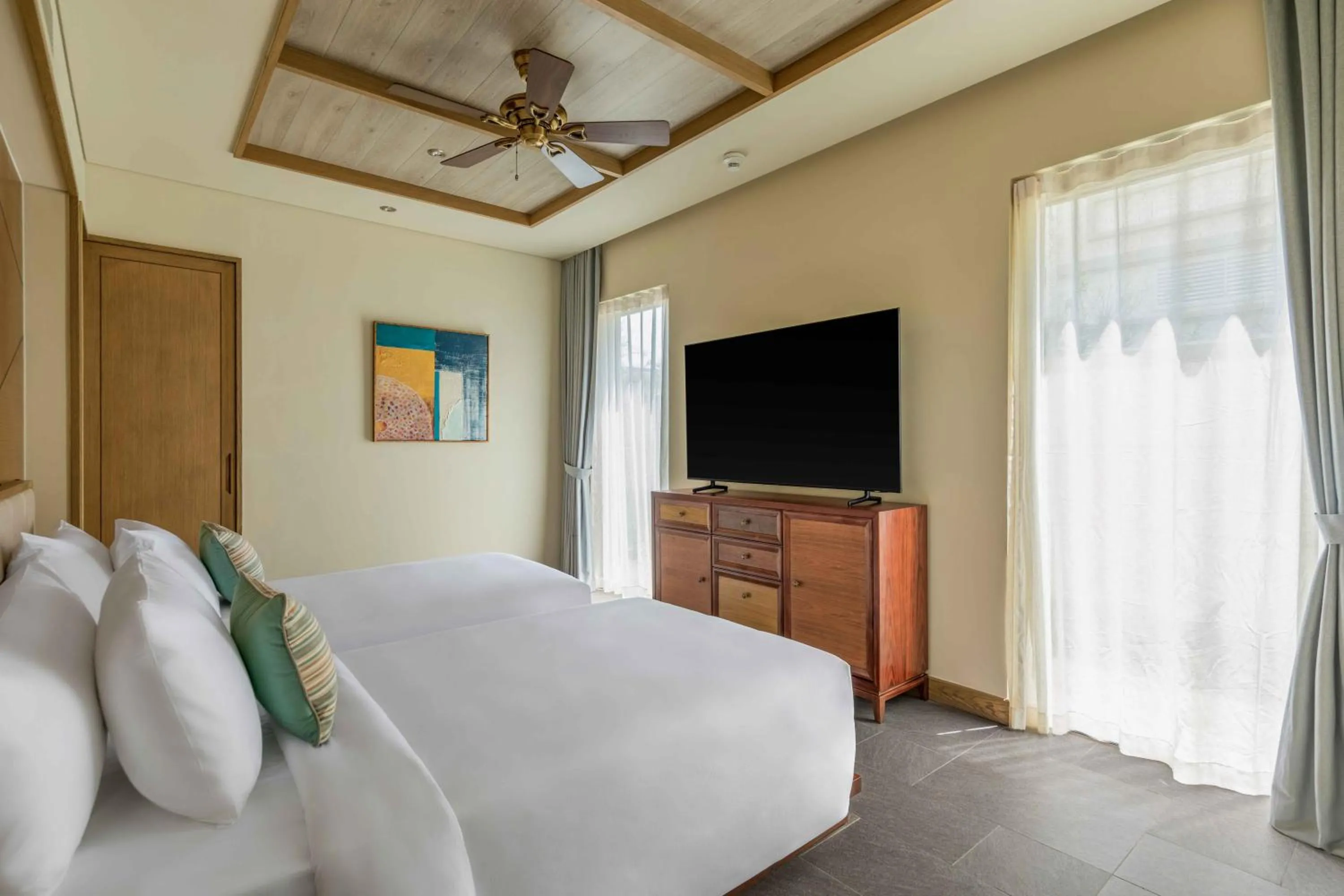 Bed in Fusion Resort and Villas Da Nang