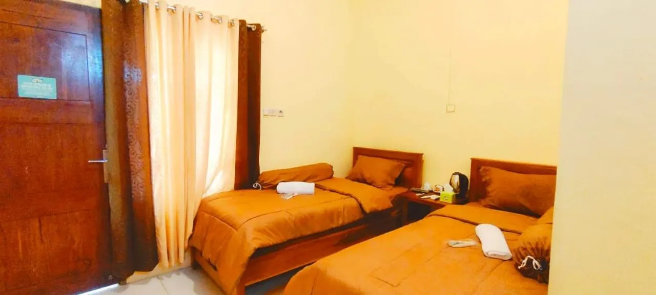 Bed in FIFAWIND HOTEL