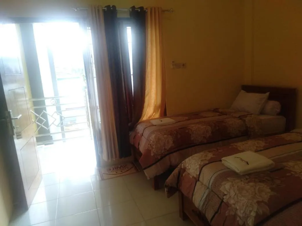 Bed in FIFAWIND HOTEL