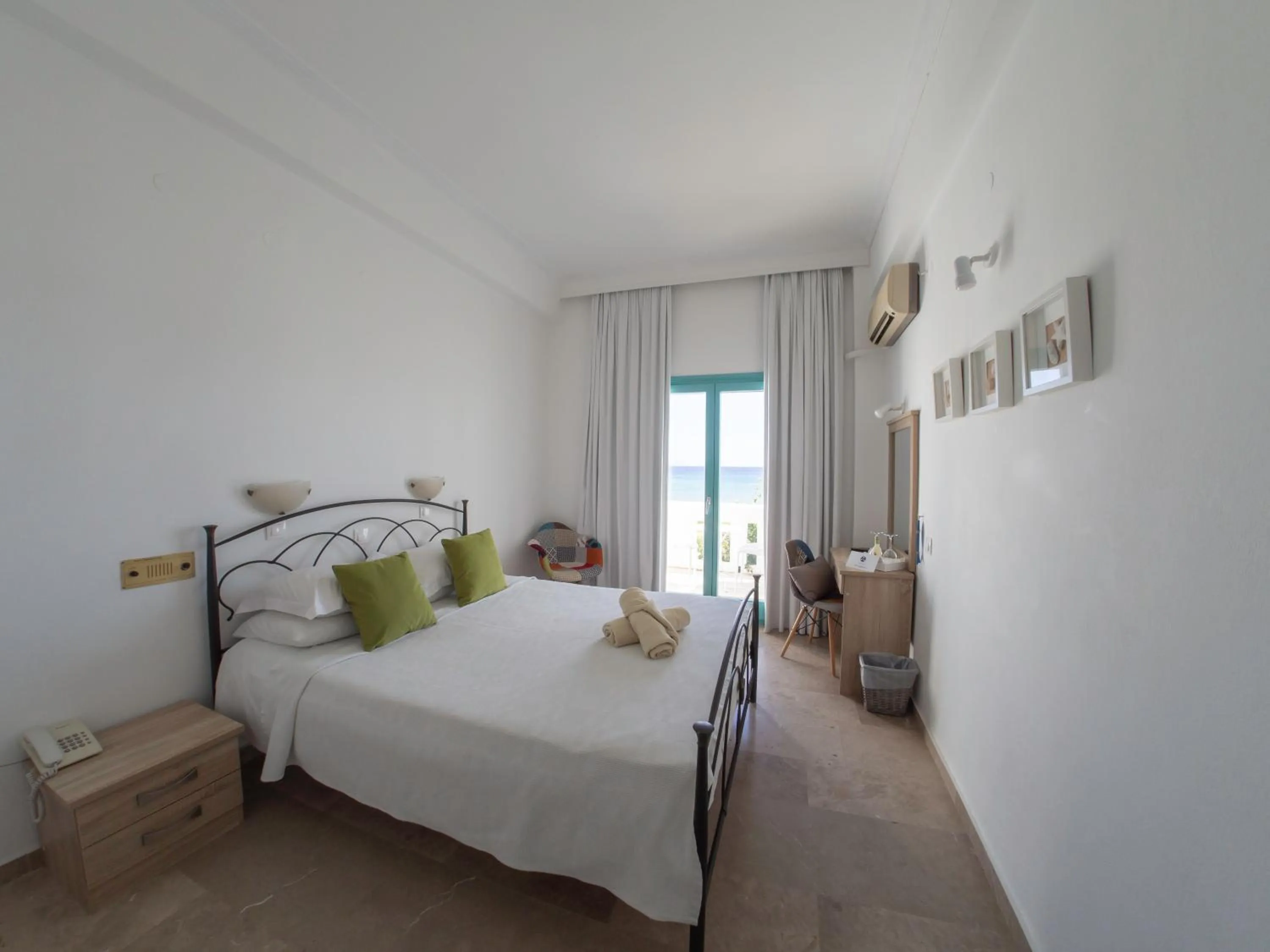 Bed in Amaryllis Beach Hotel