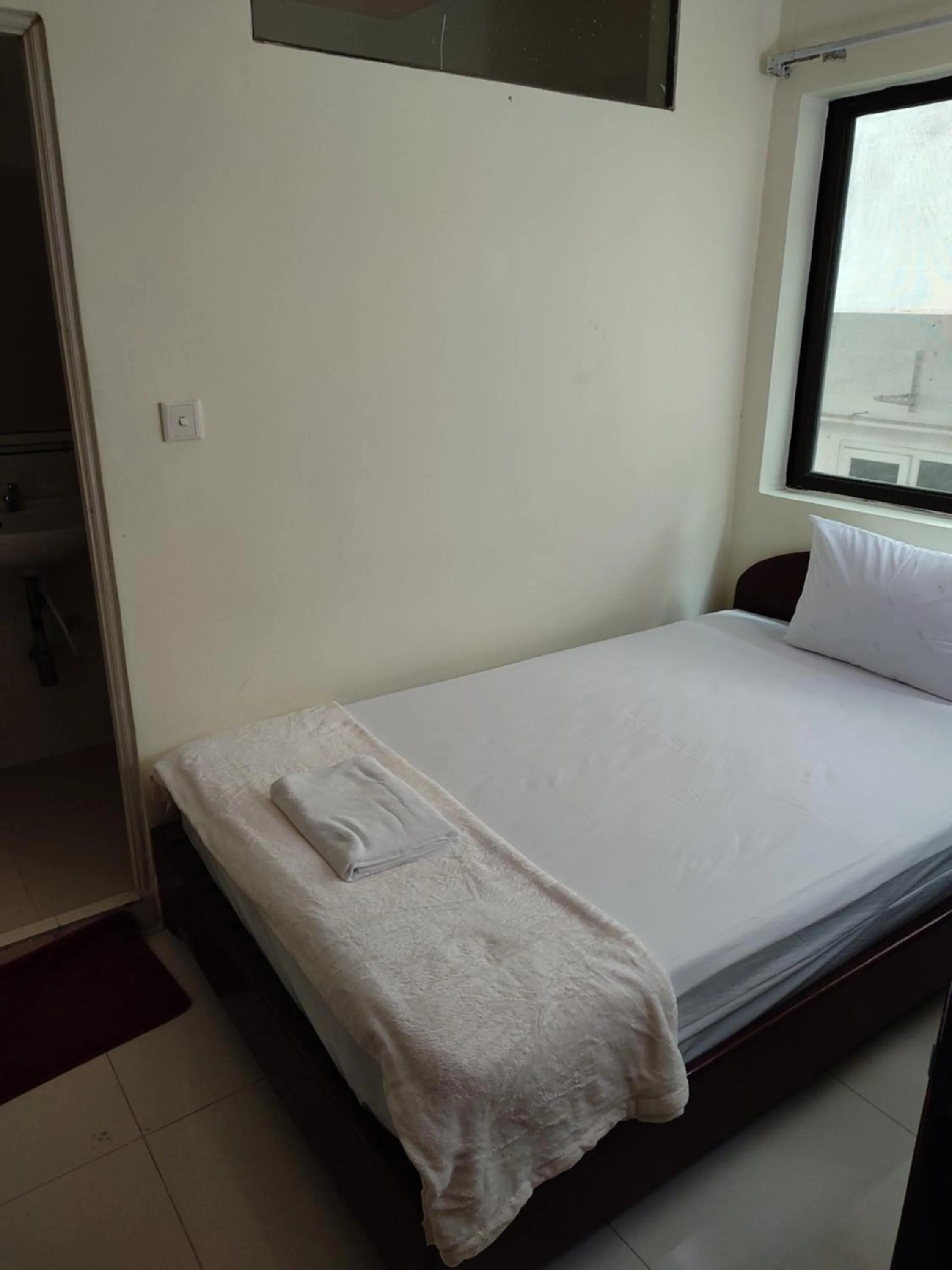 Bed in GALAXY Rs HOTEL