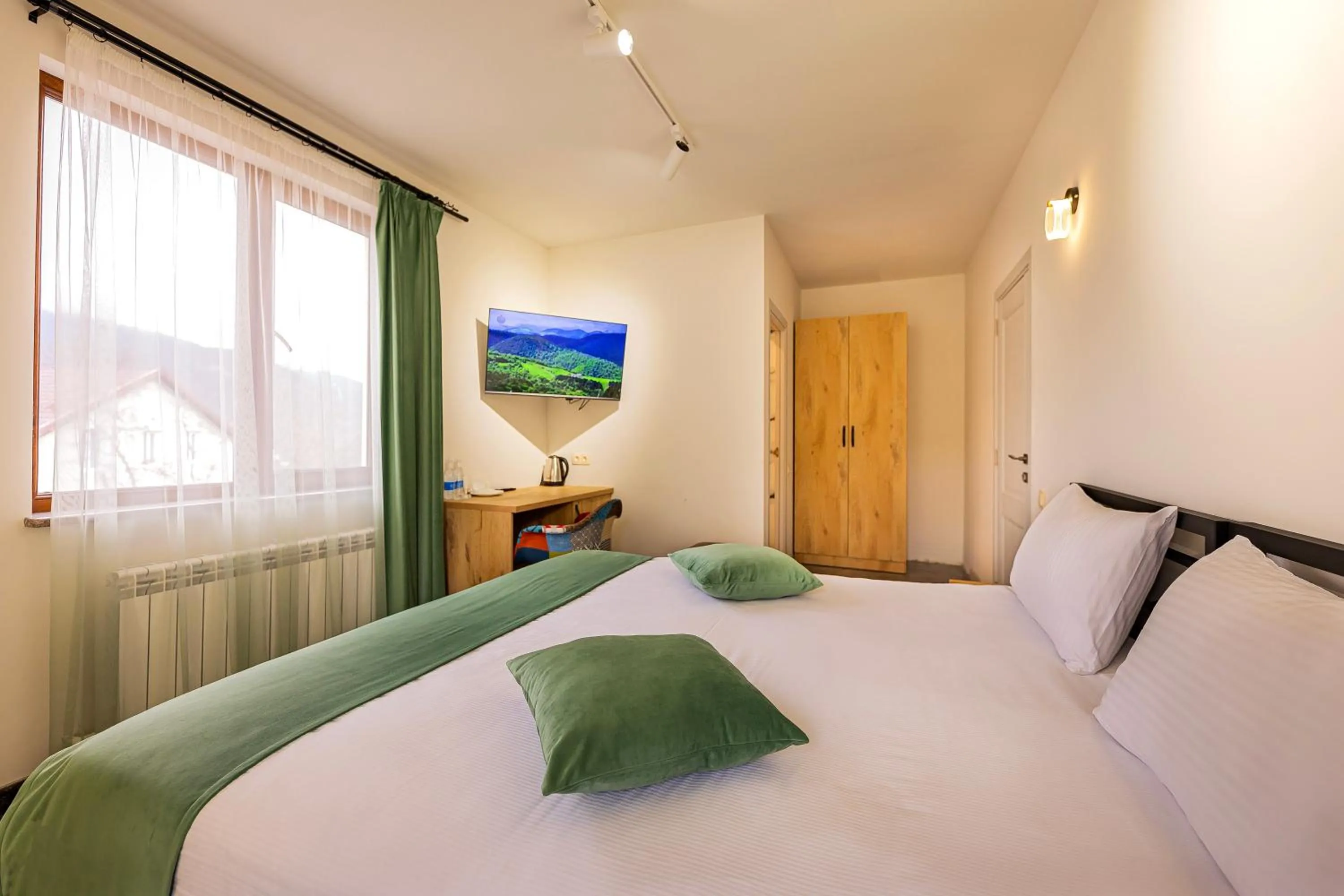 Bed in ARSIS Family Hotel