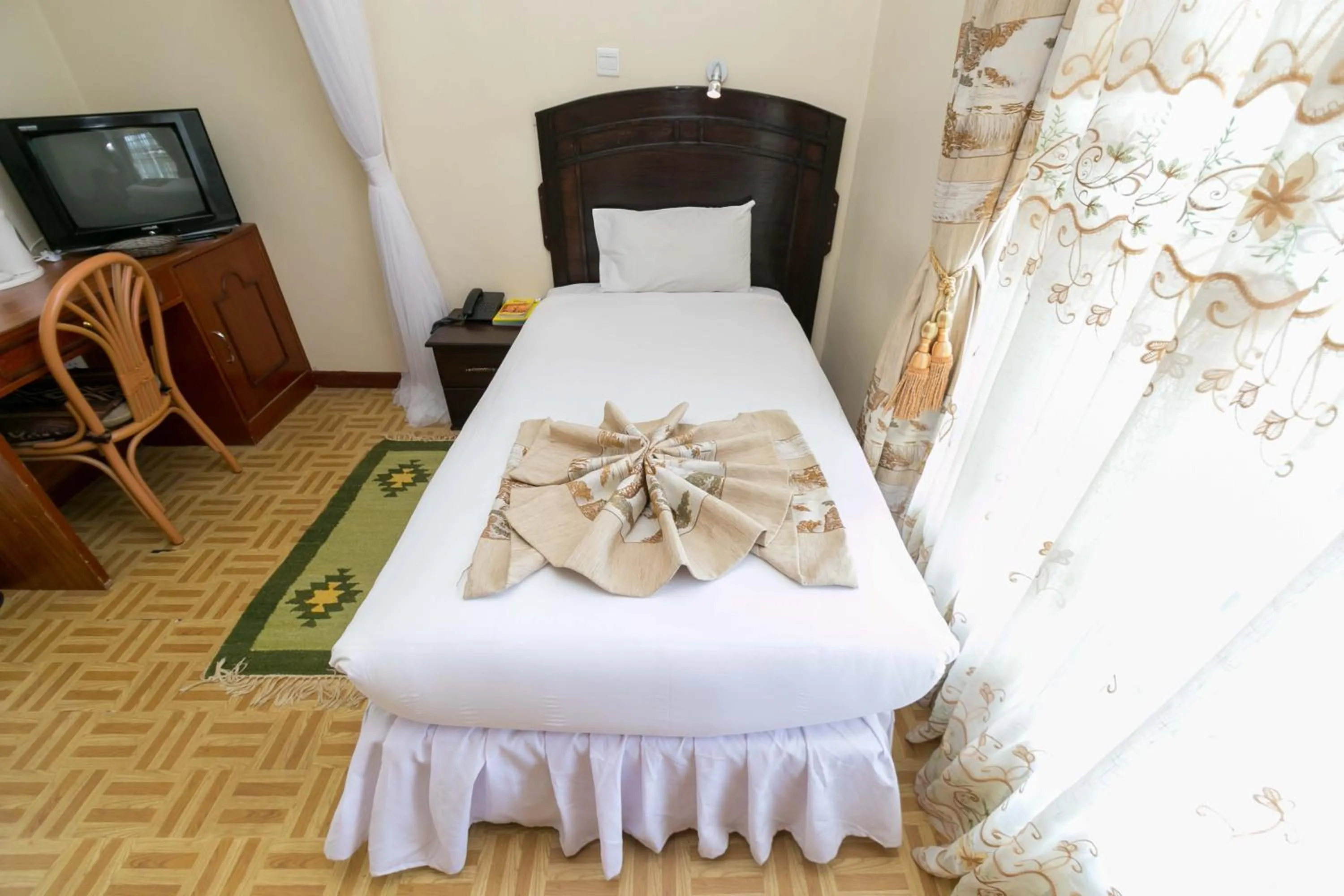 Photo of the whole room, Bed in Fahari Gardens Hotel