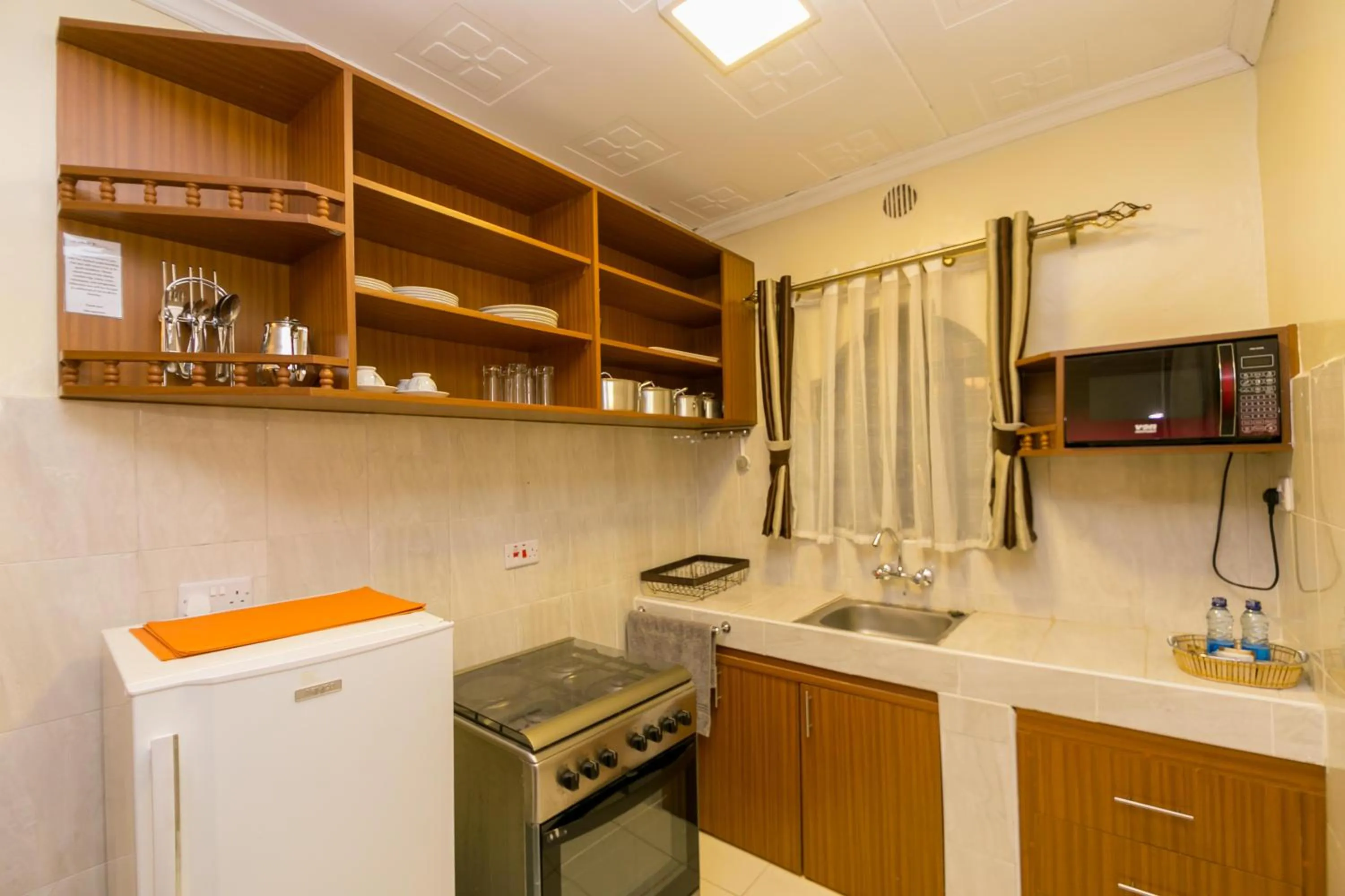 Kitchen or kitchenette in Fahari Gardens Hotel
