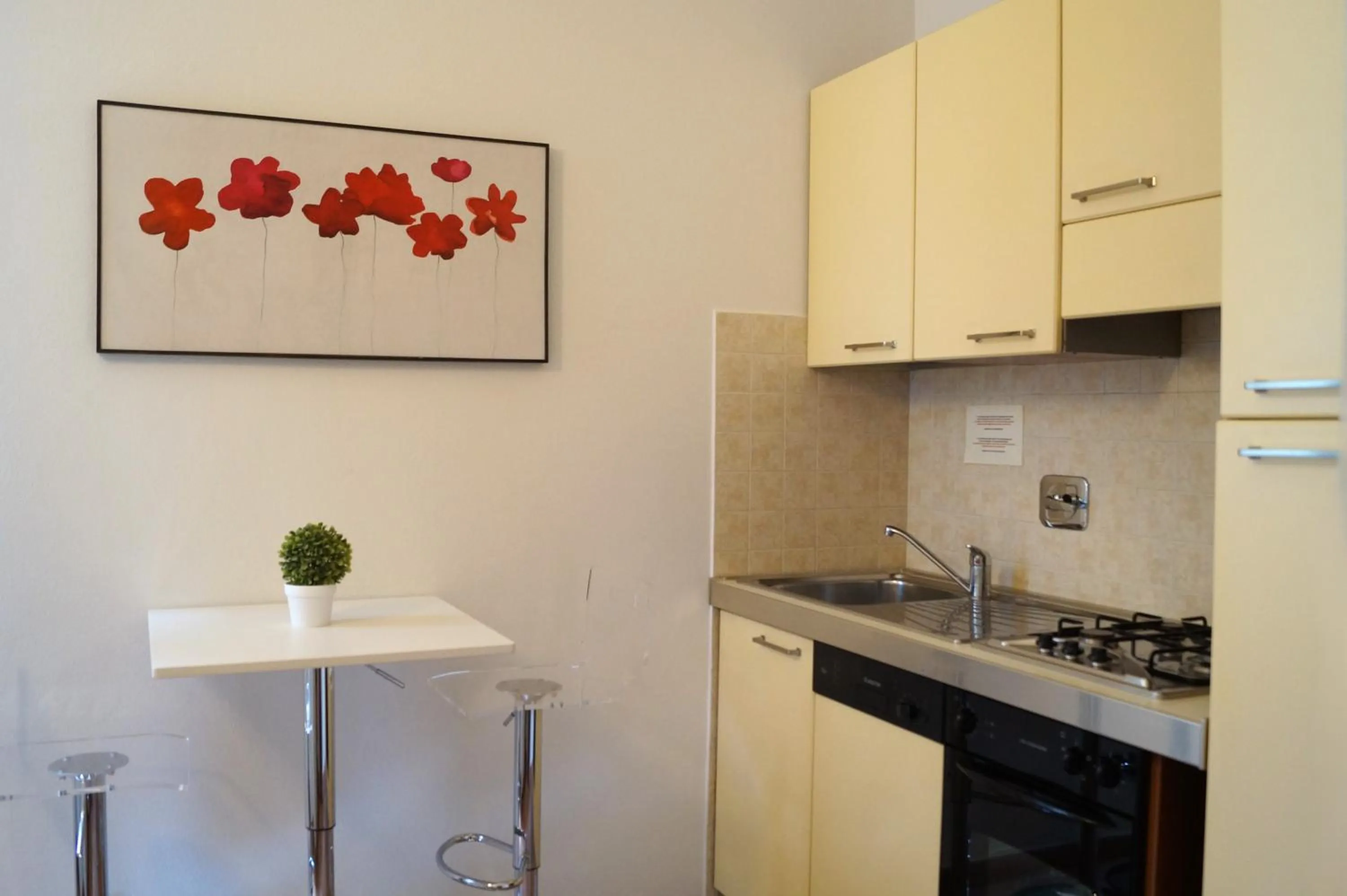 Kitchen or kitchenette in Loger Confort Residence & Apartments