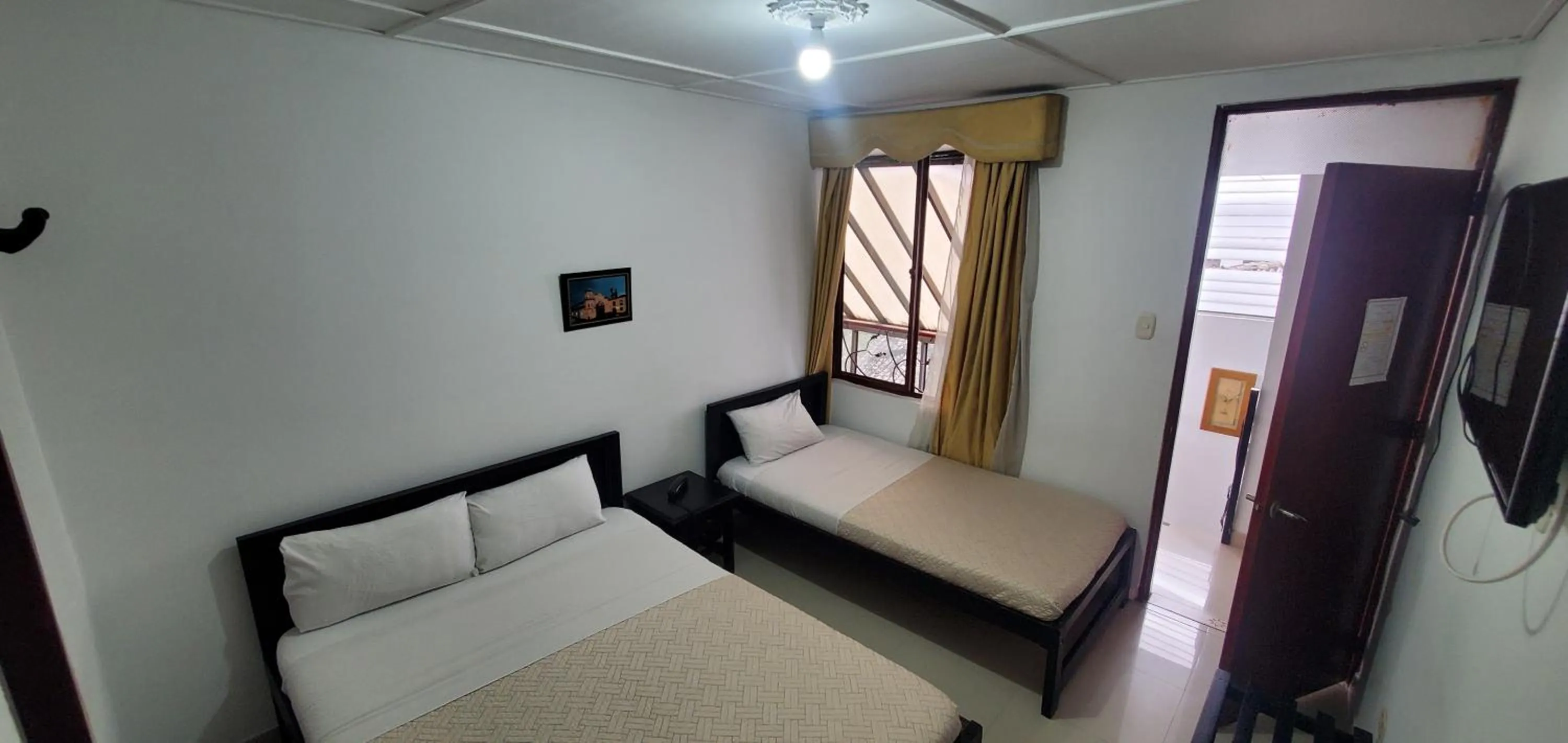 Bed in Hotel Popayan Plaza