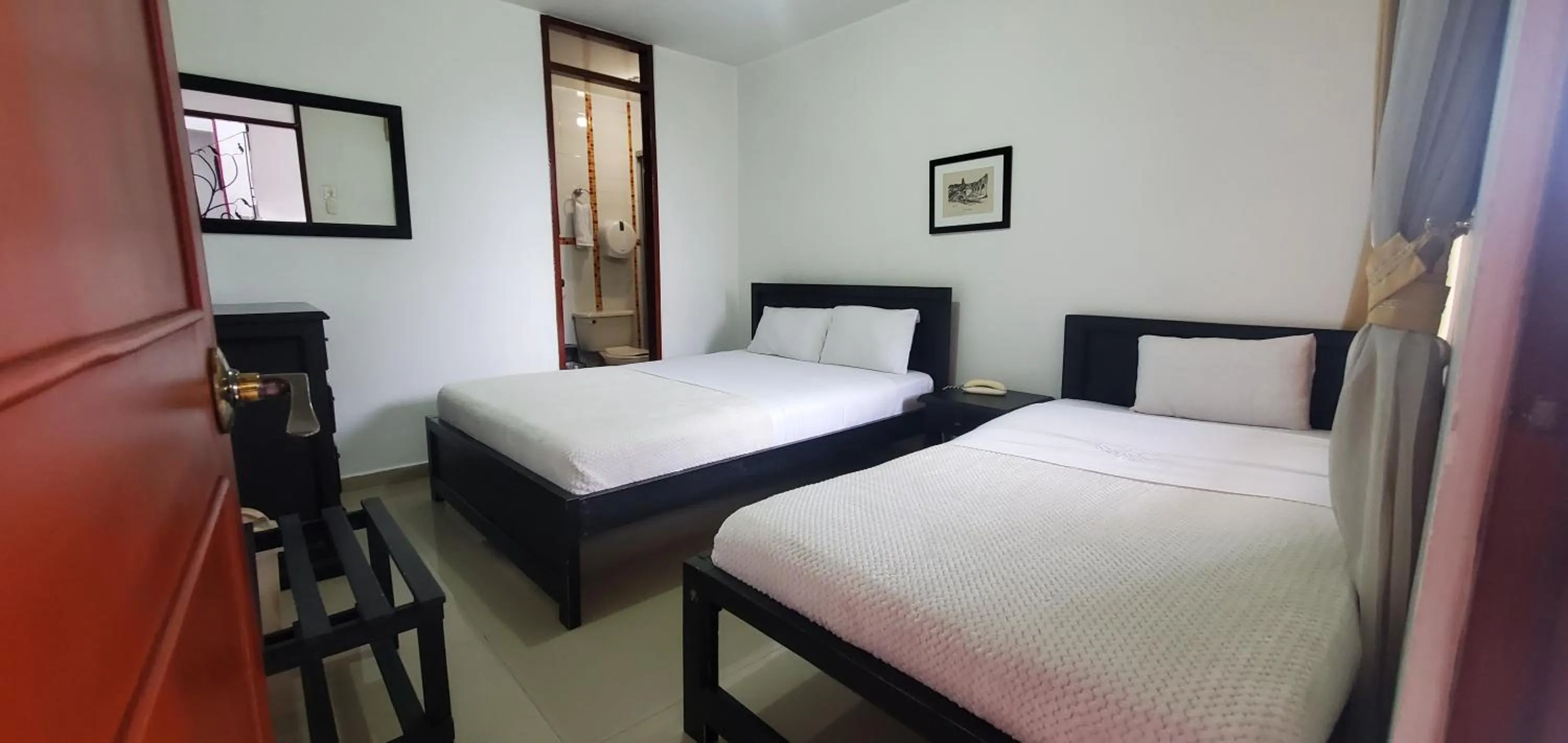 Bed in Hotel Popayan Plaza