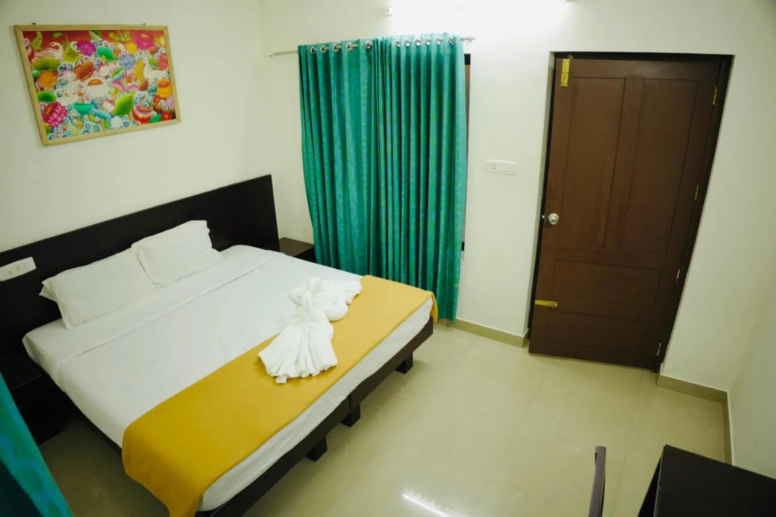 Photo of the whole room, Bed in Padmatheertham Inn