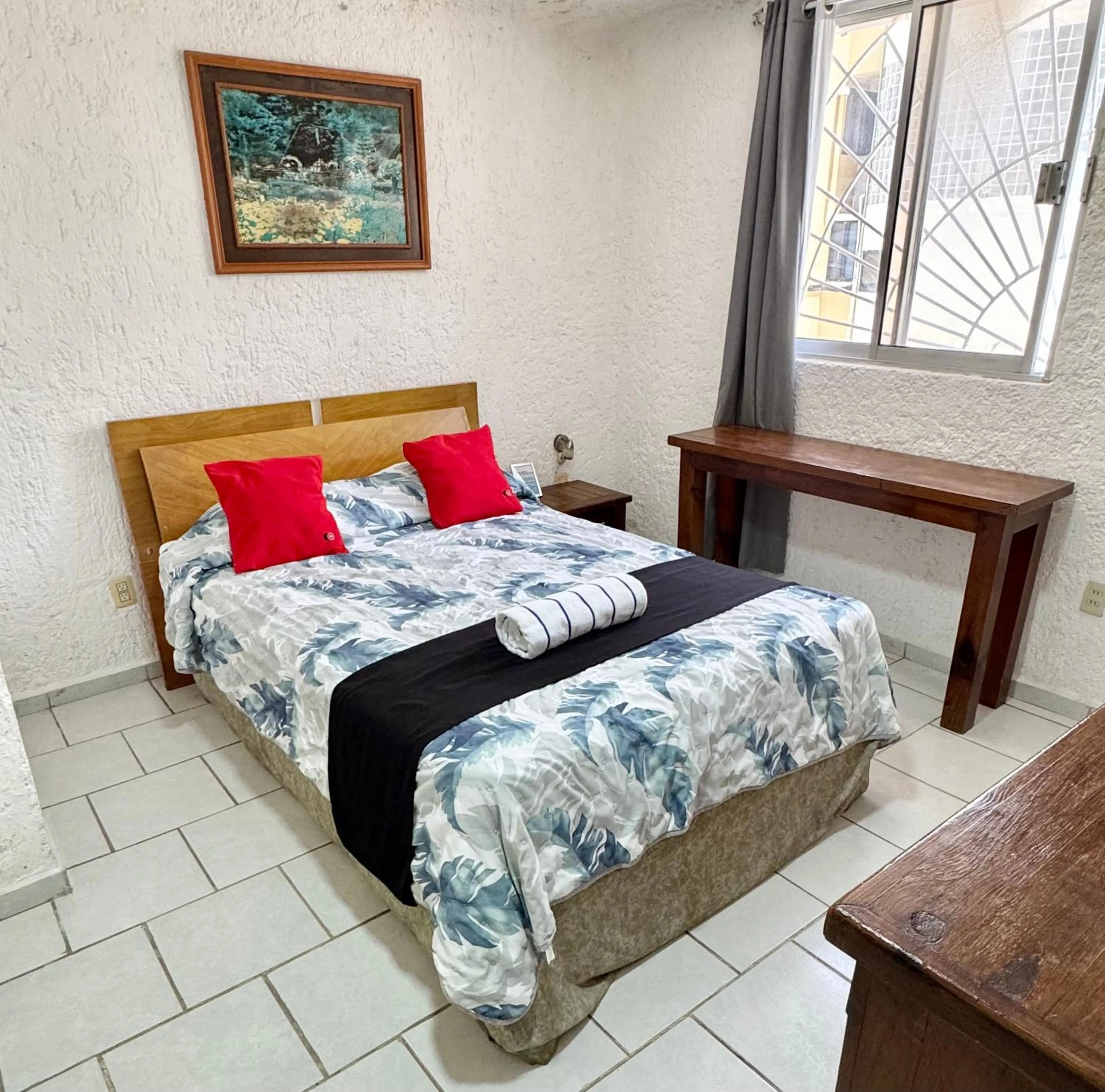 Bed in Hotel Farallon Inn Cancún