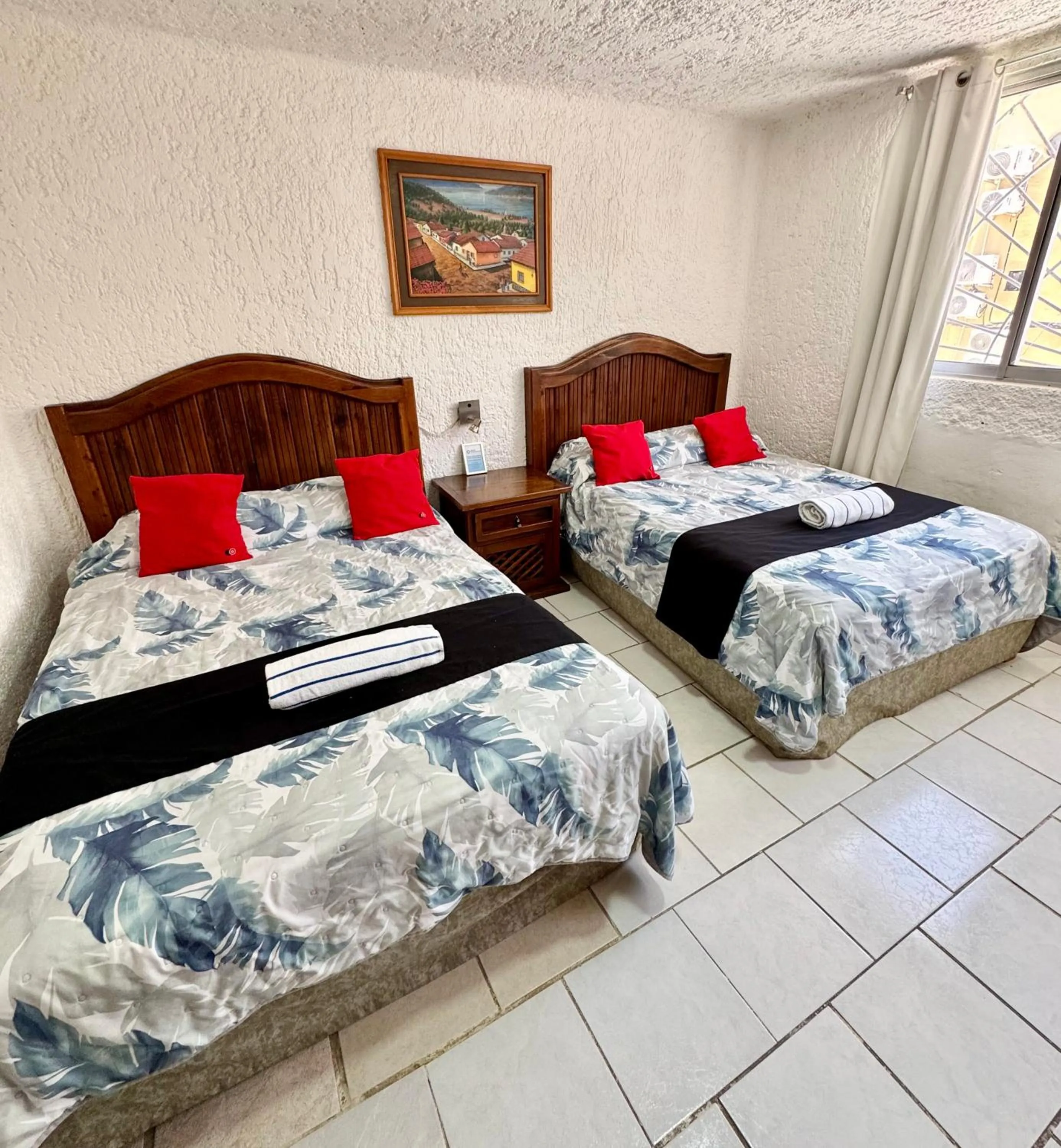 Bed in Hotel Farallon Inn Cancún