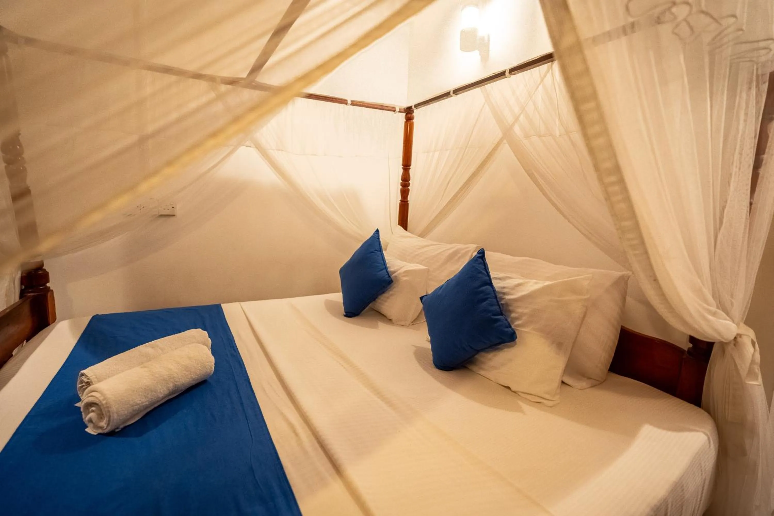 Bed in Coral Beach Hotel