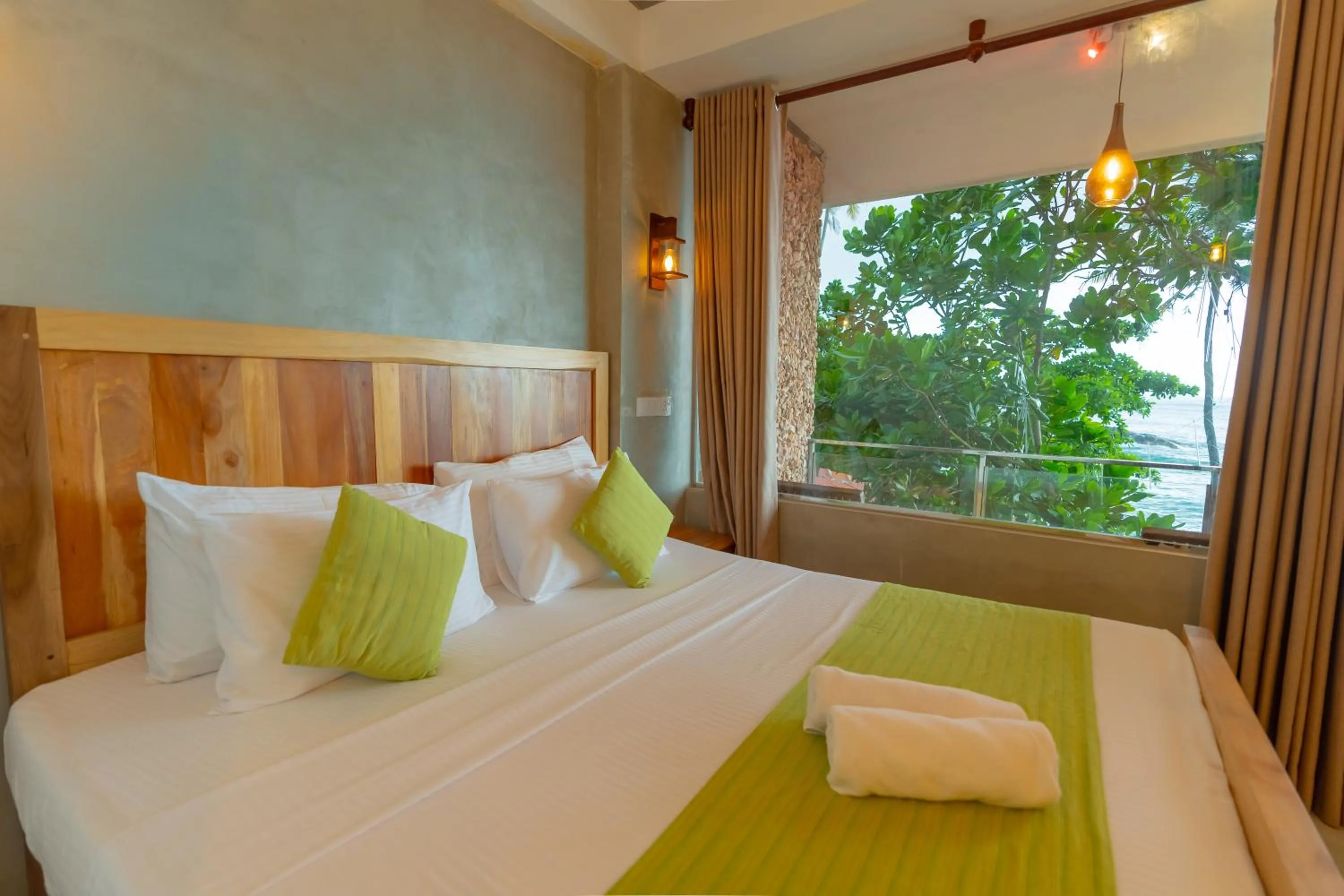 Bed in Coral Beach Hotel