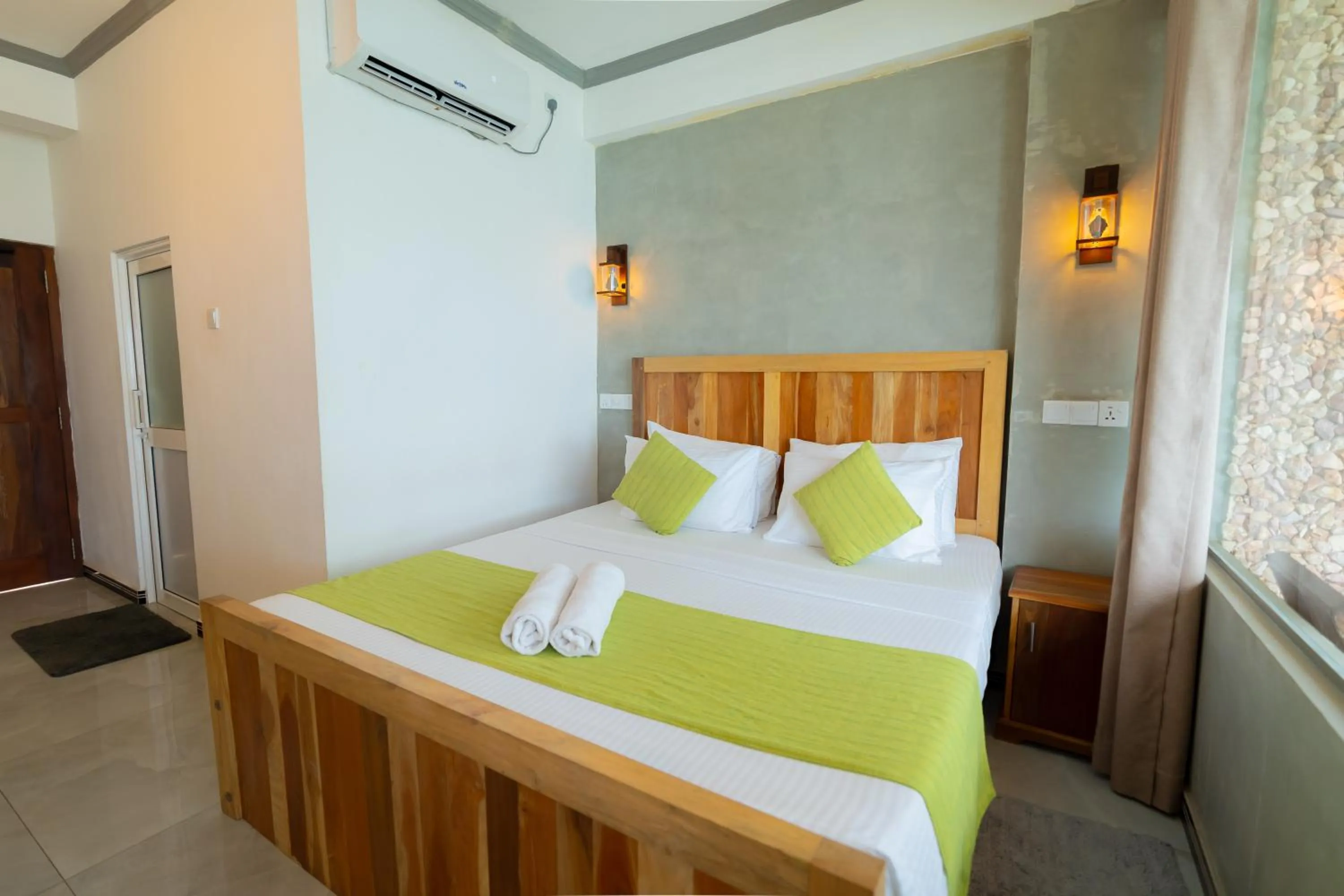 Bed in Coral Beach Hotel