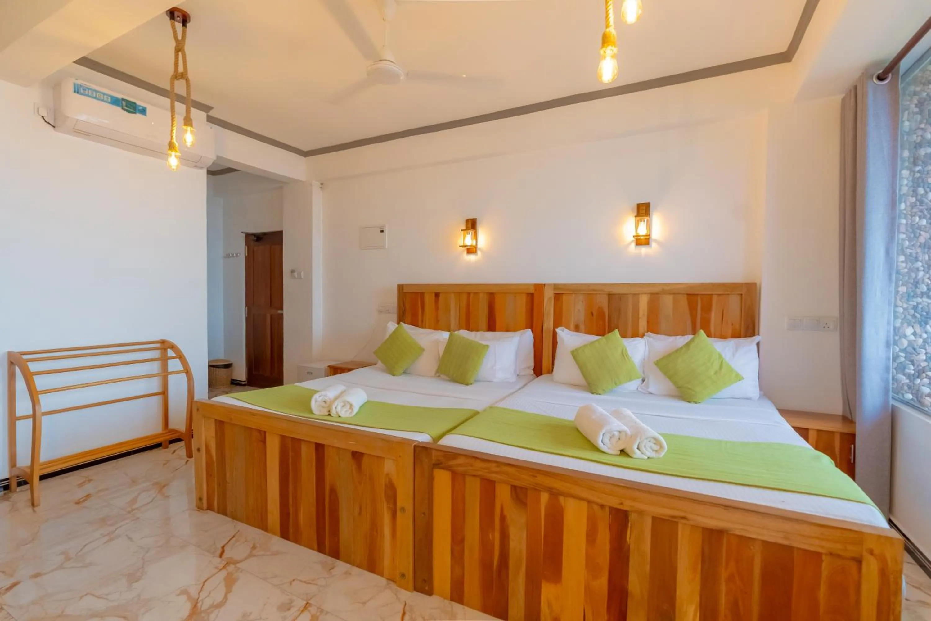 Bed in Coral Beach Hotel