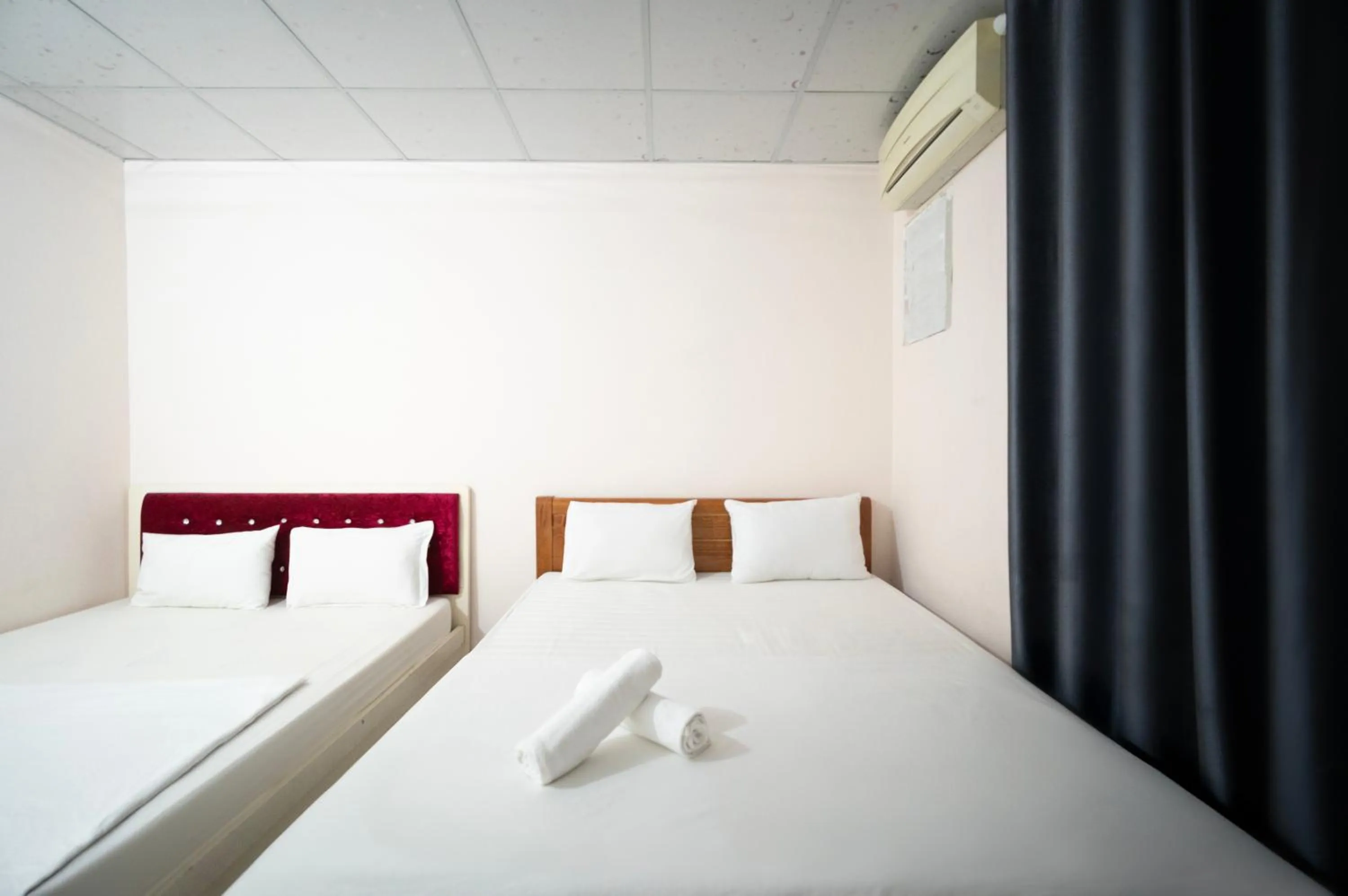 Bed in CROWNE BUI VIEN Hotel