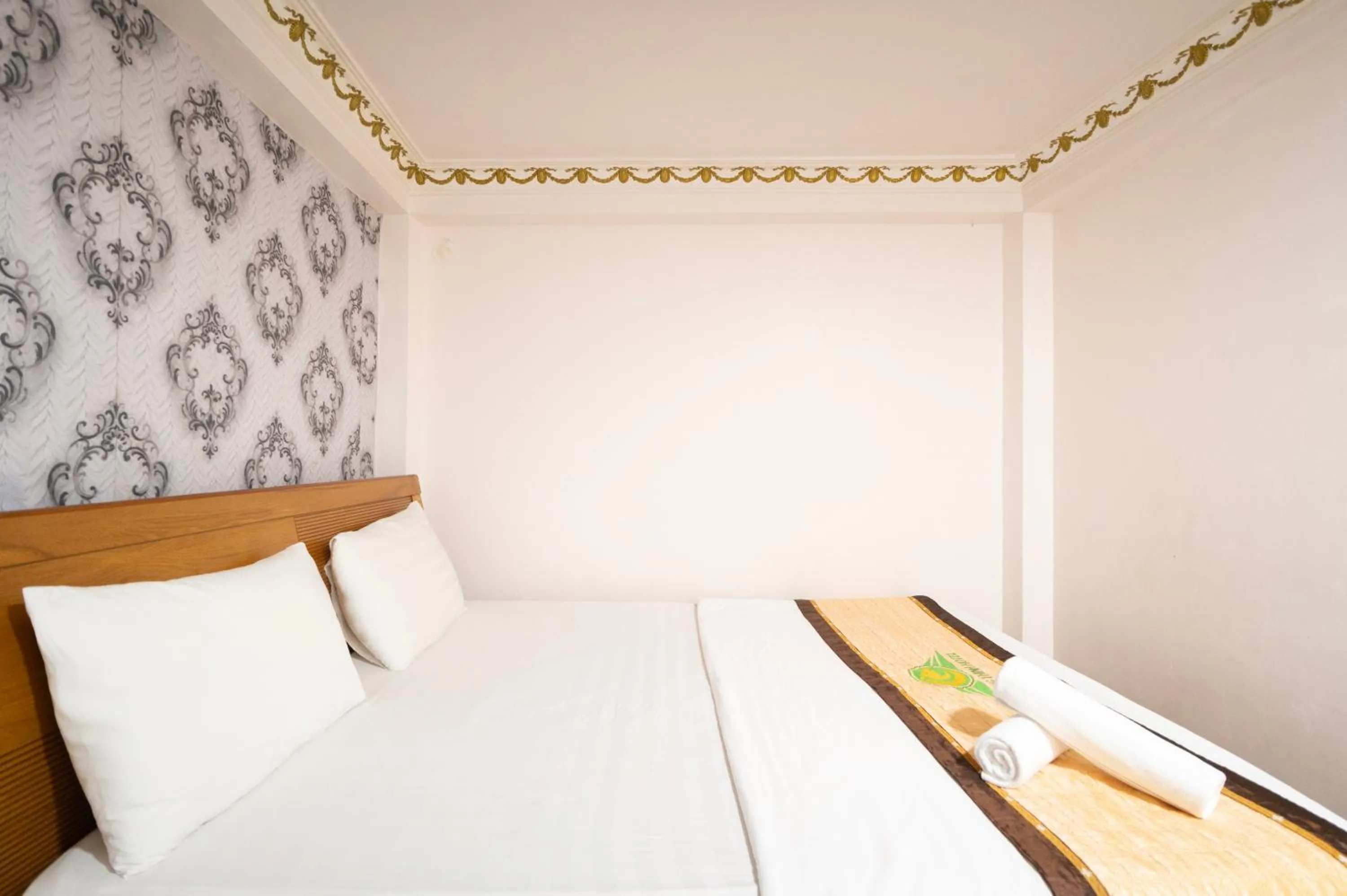 Bed in CROWNE BUI VIEN Hotel