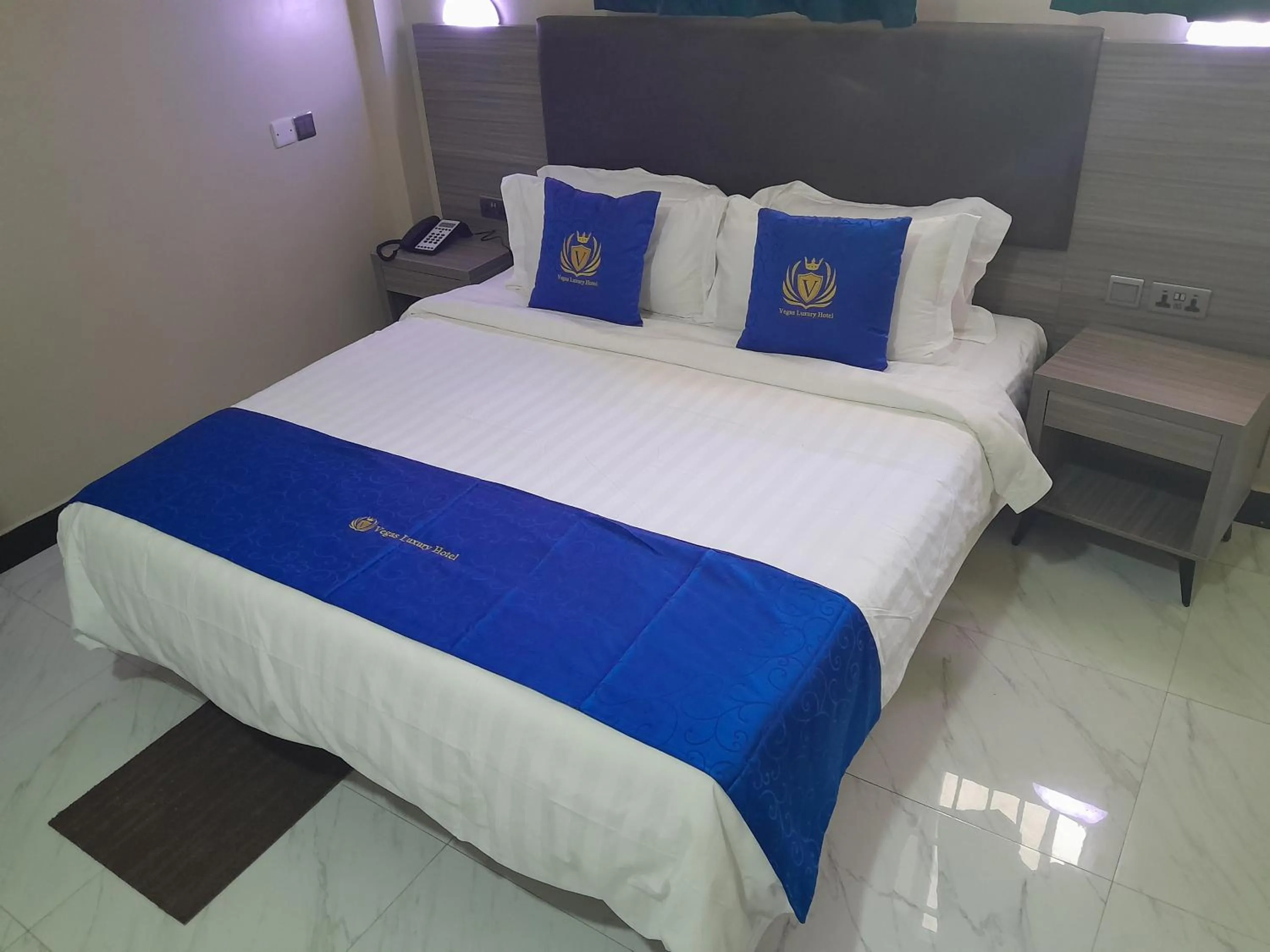 Bed in VEGAS LUXURY HOTEL