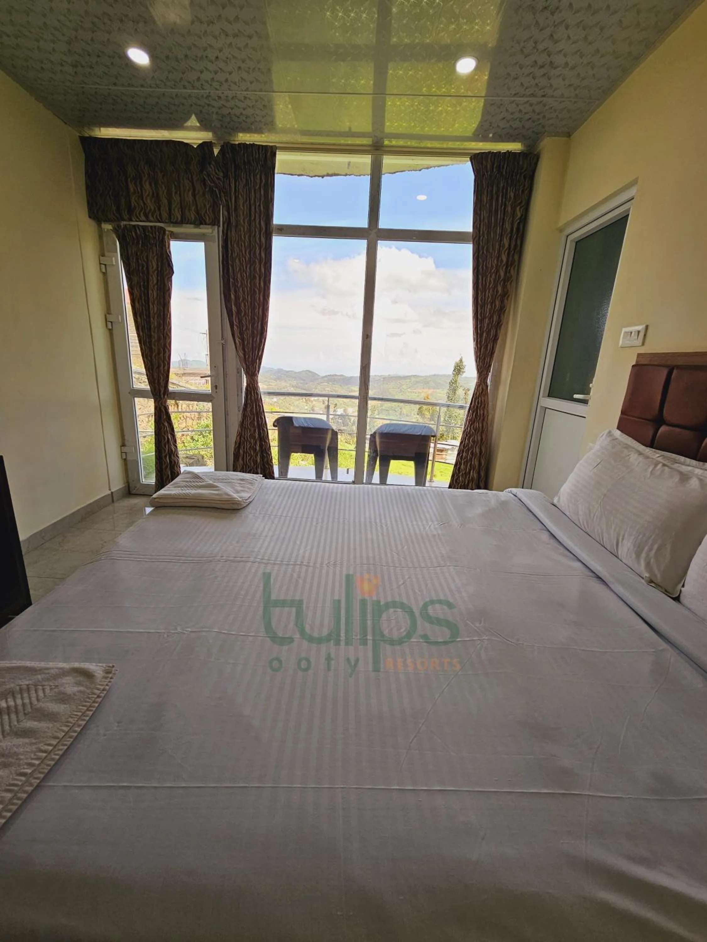 Balcony/Terrace, Bed in Tulips Village Resorts