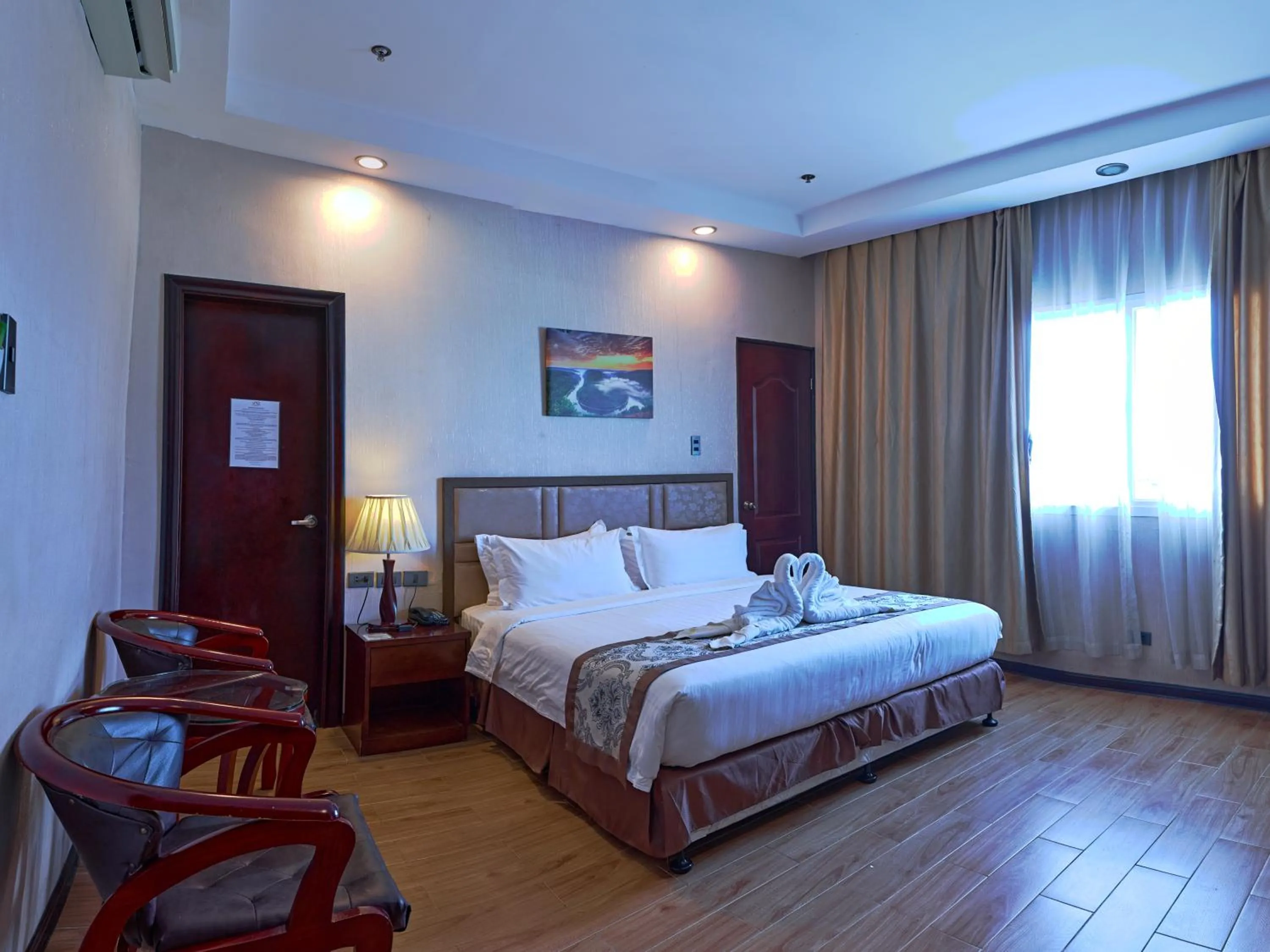 Bed in Palawan Uno Hotel