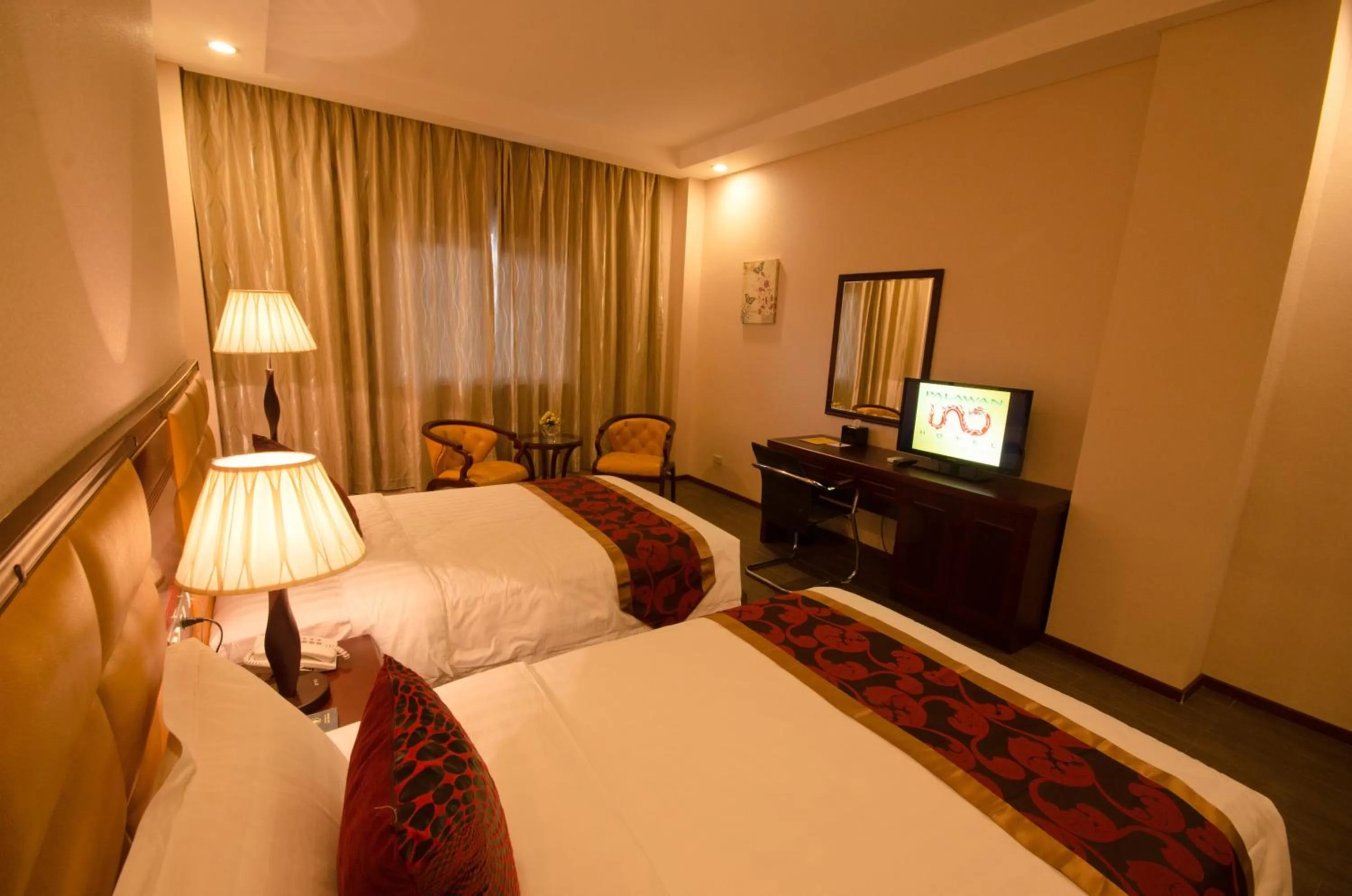 Photo of the whole room, Bed in Palawan Uno Hotel