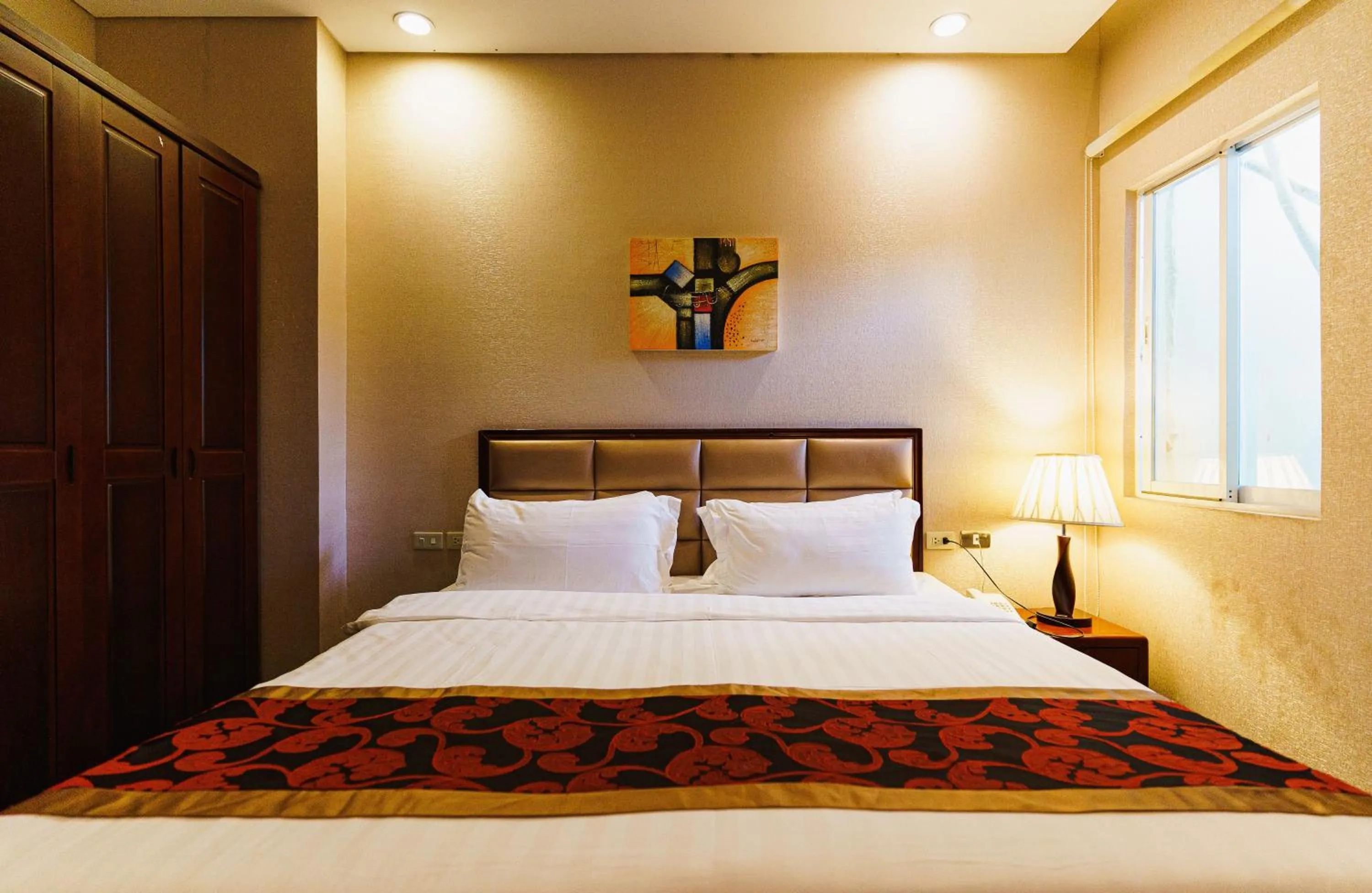 Bed in Palawan Uno Hotel