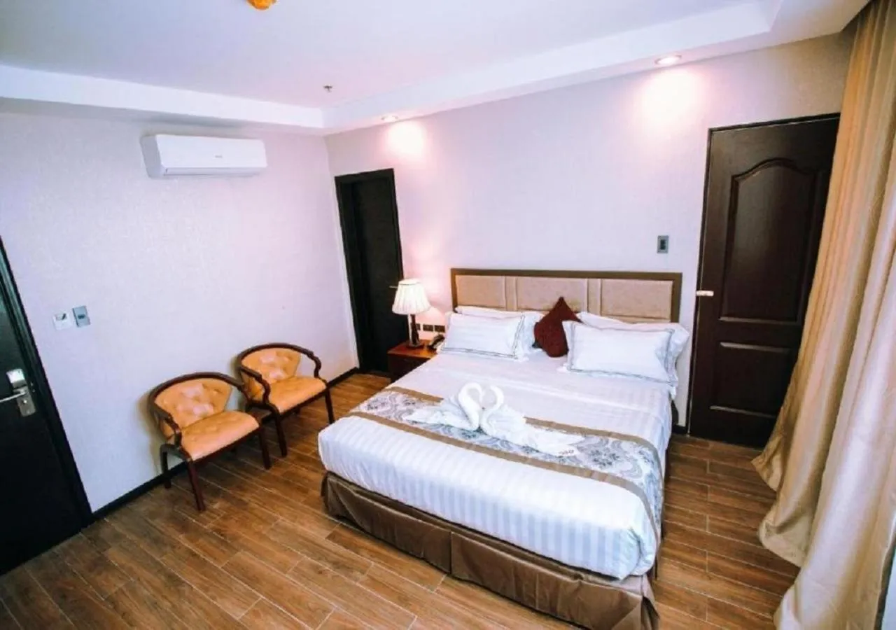 Bed in Palawan Uno Hotel