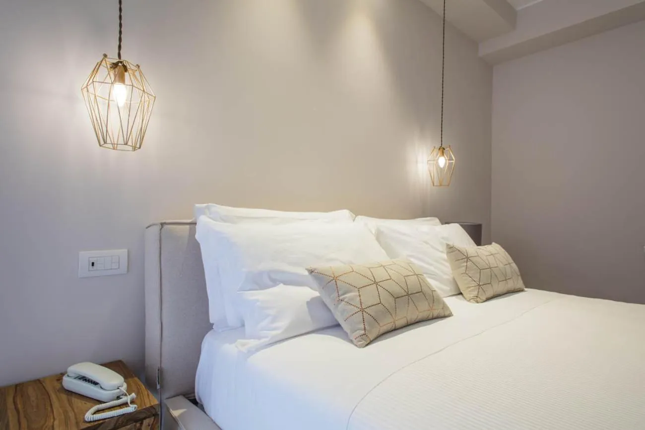 Bed in Manè Boutique Hotel