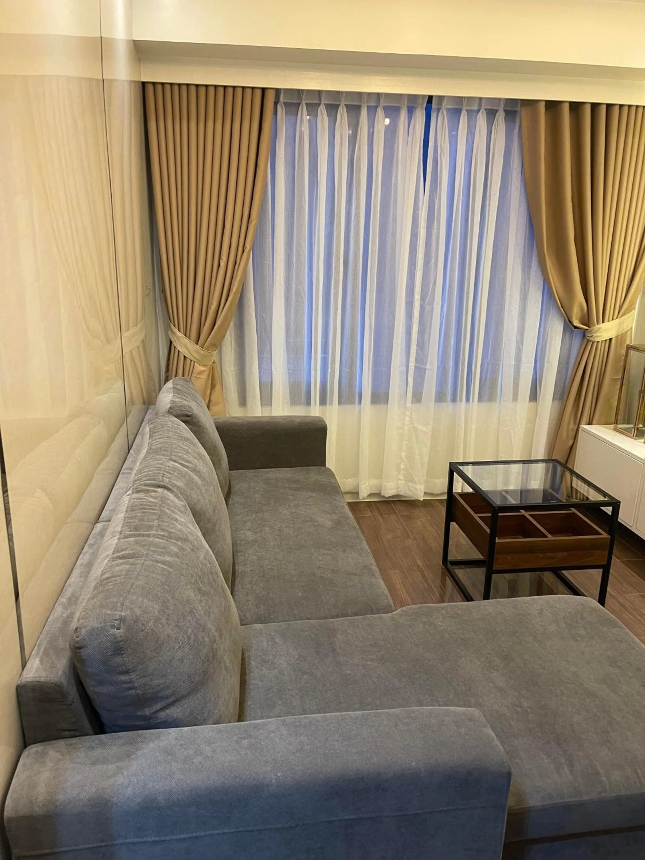 Living room in E & T Homecations 2 Bedroom Apartment at SMDC Air Residences