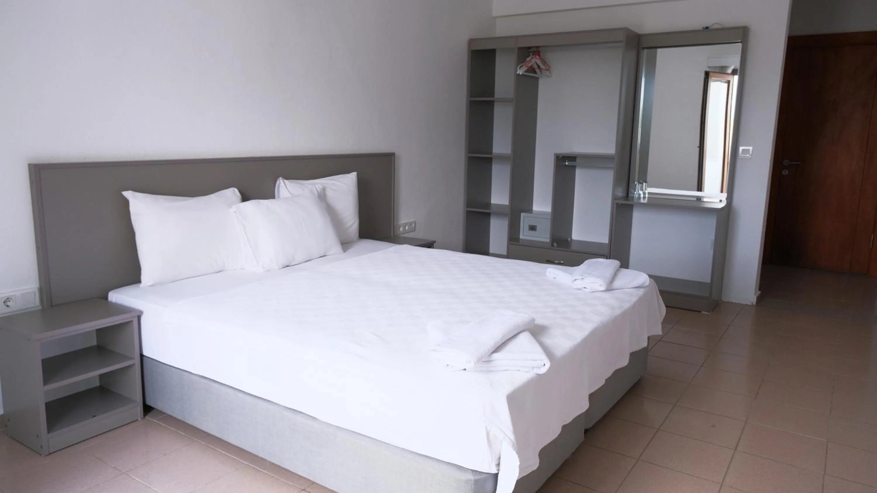 Bed in Gumbet Cove Hotel