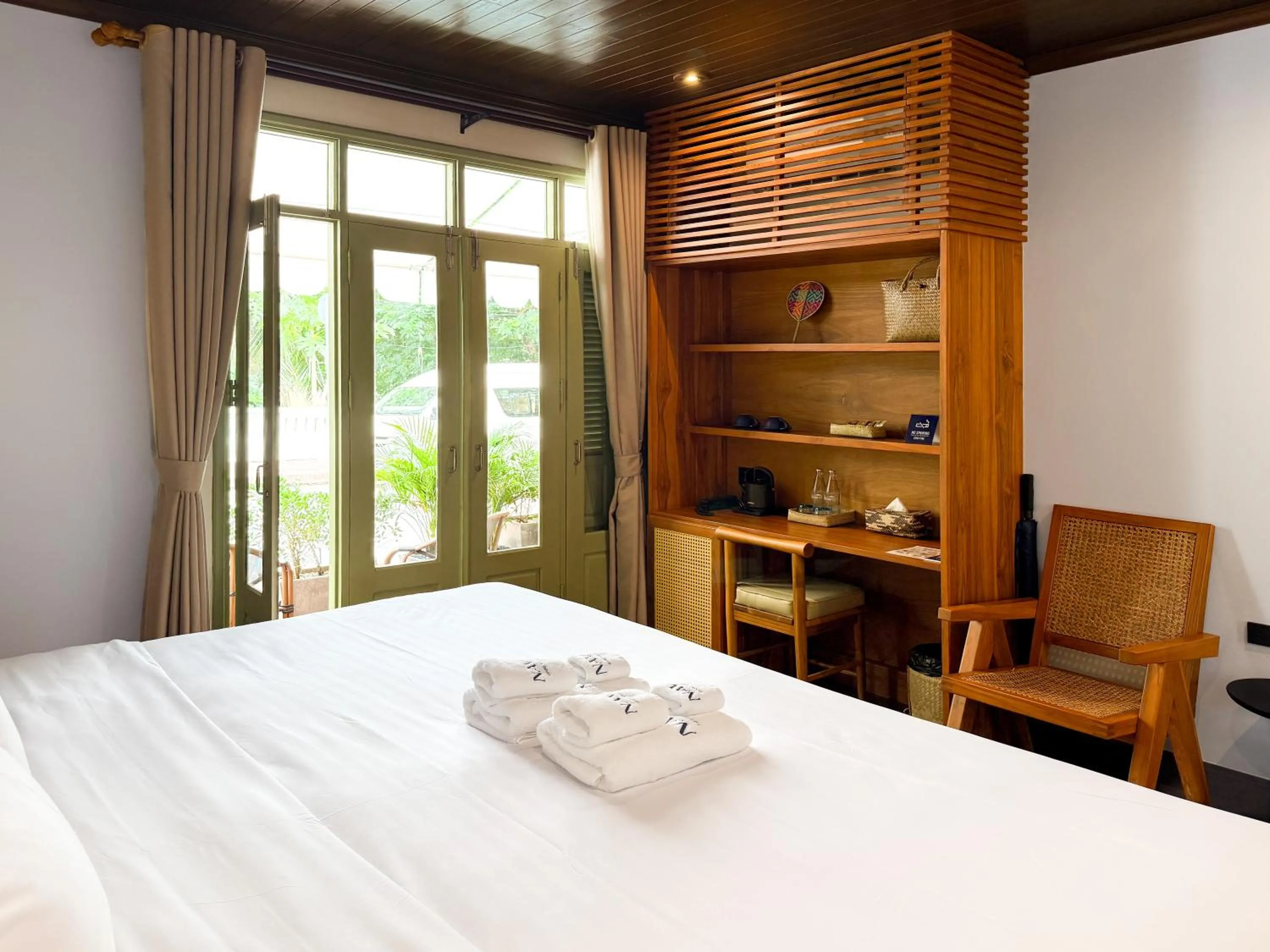 Photo of the whole room, Bed in Nava Luang Prabang Hotel