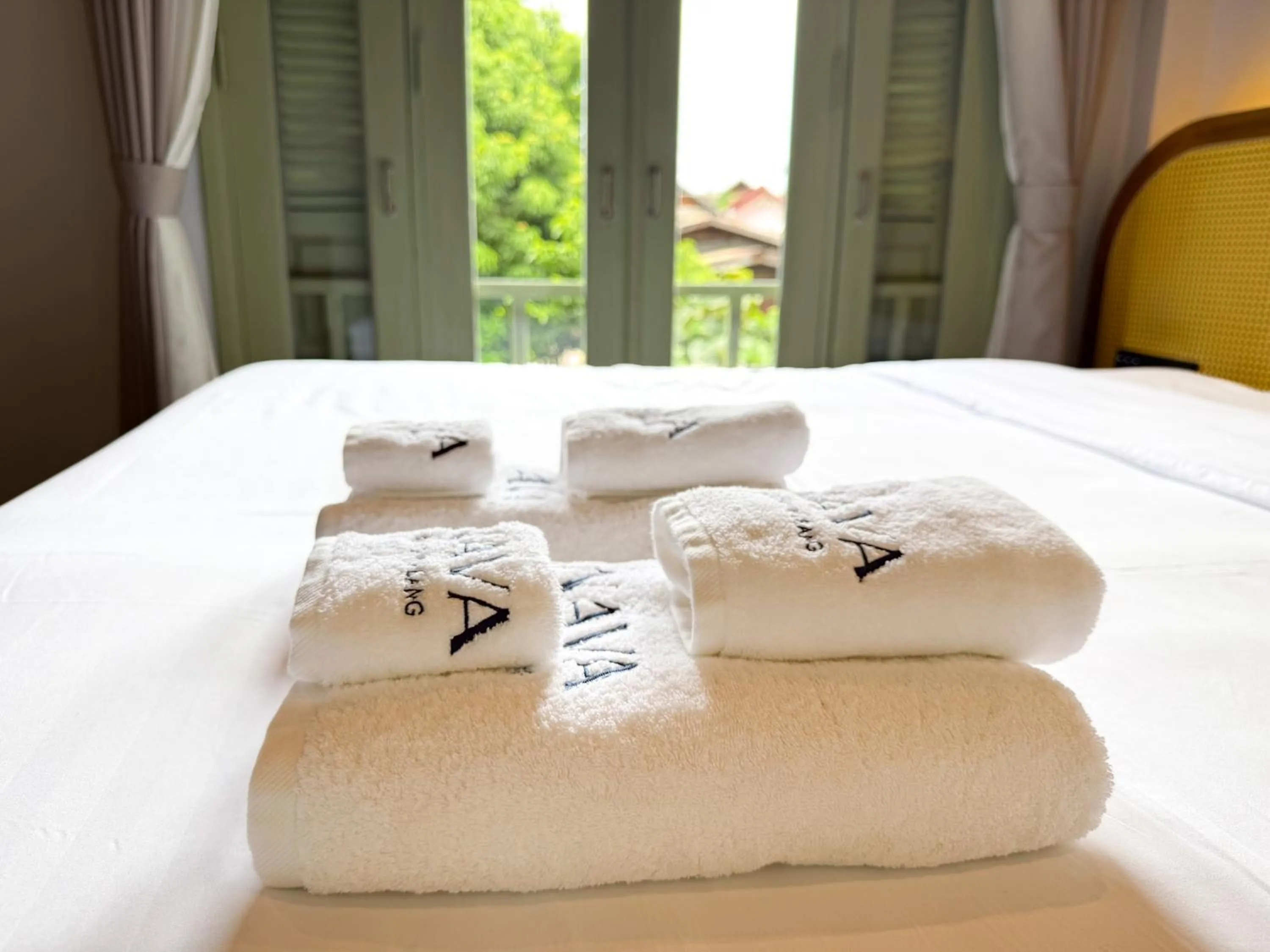 towels, Bed in Nava Luang Prabang Hotel