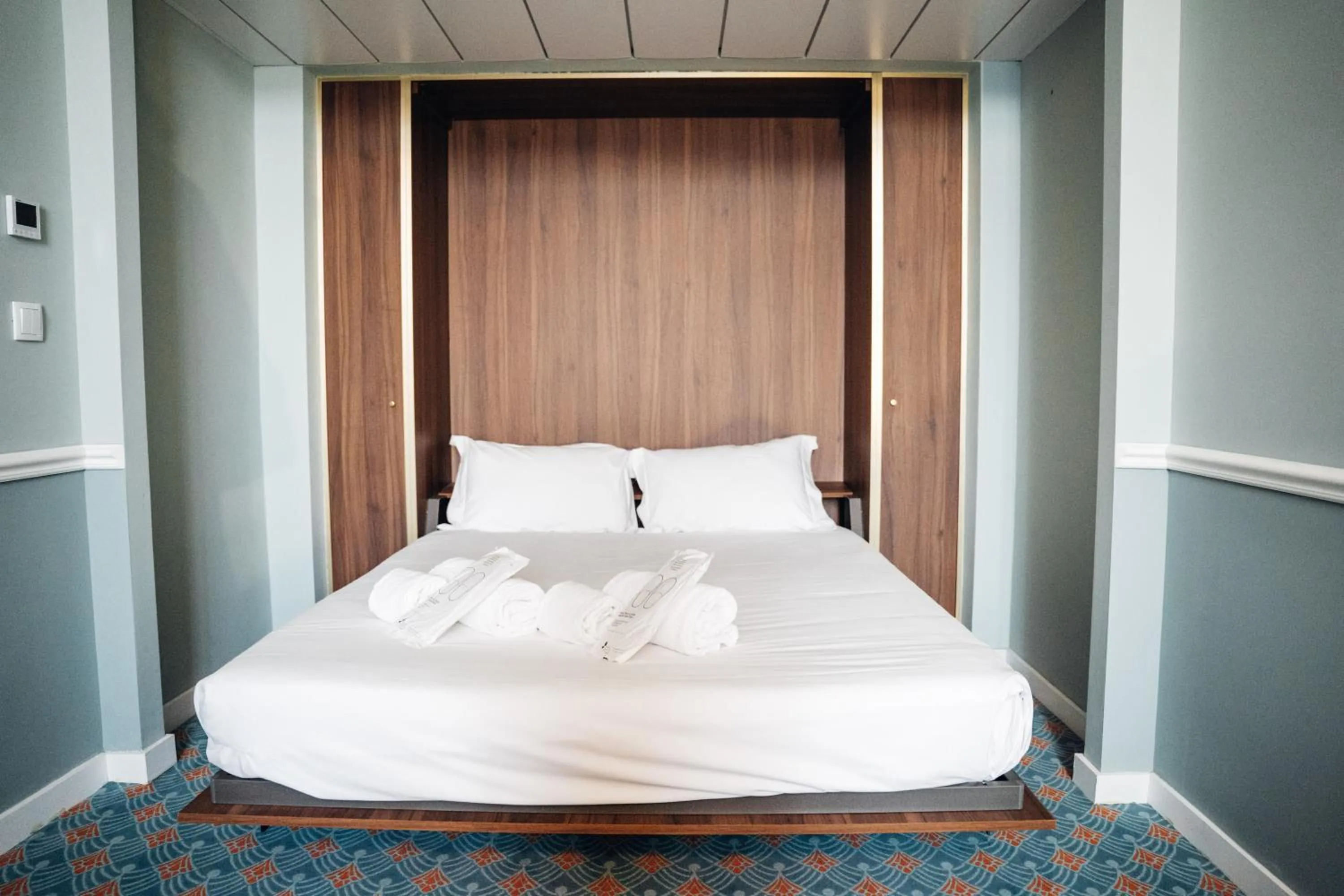 Bed in GRANDE HOTEL PARIS by STAY HOTELS