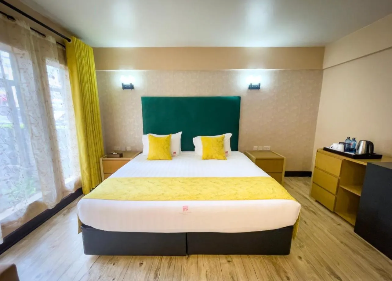 Bed in West Wood Hotel